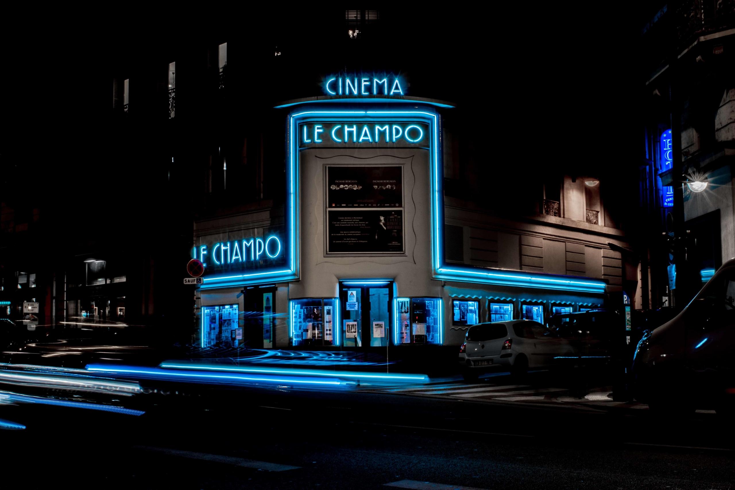 Le Champo Cinema in Paris lit up in blue at night