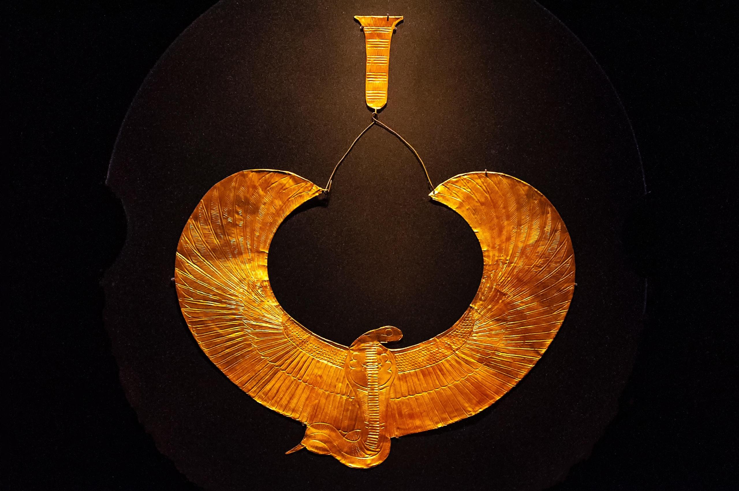 golden symbol depicting mythical creature