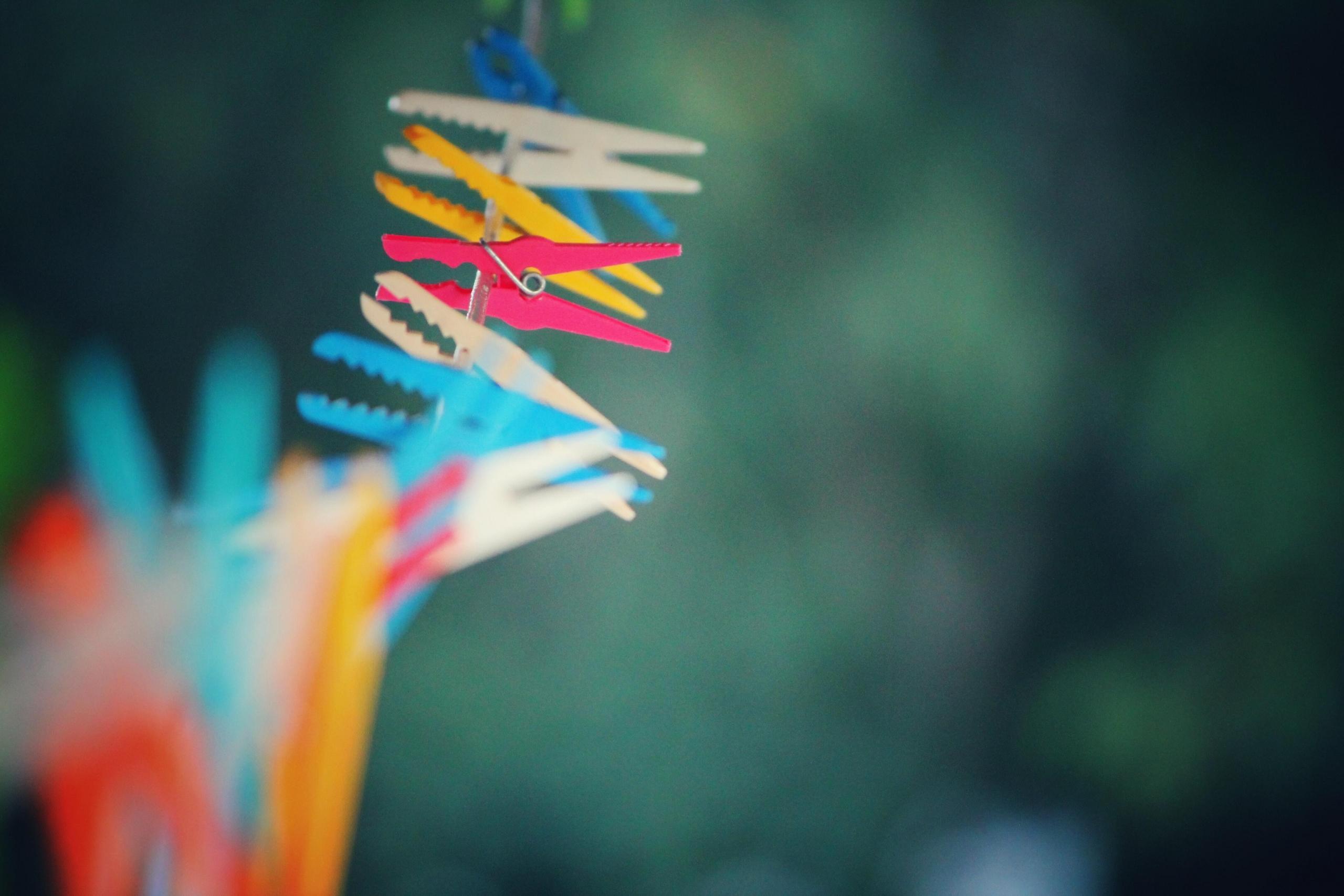 outdoor washing line with colourful plastic pegs