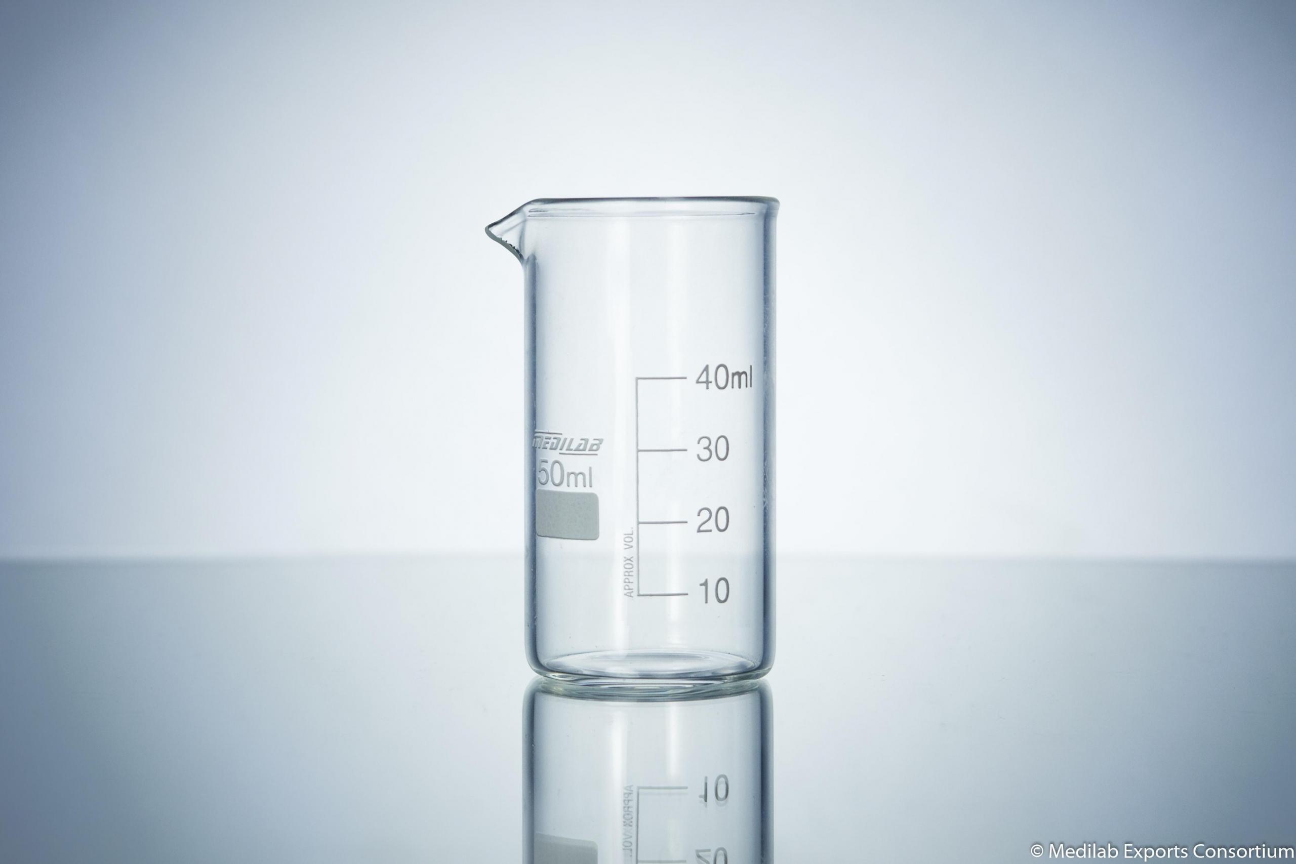 beaker with white measurement markings