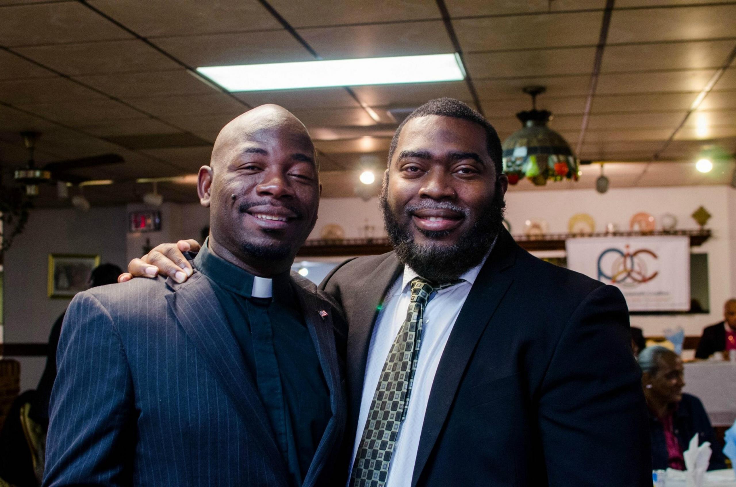 pastor and congregant smiling