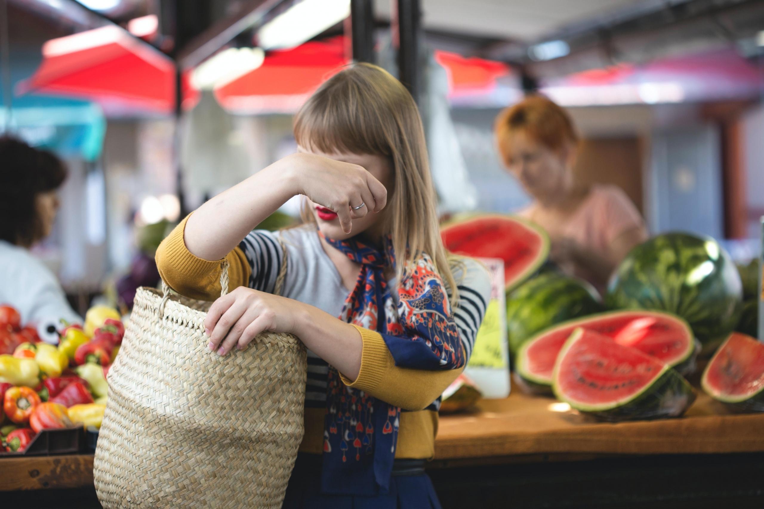 woman shopping for fresh produce at a market