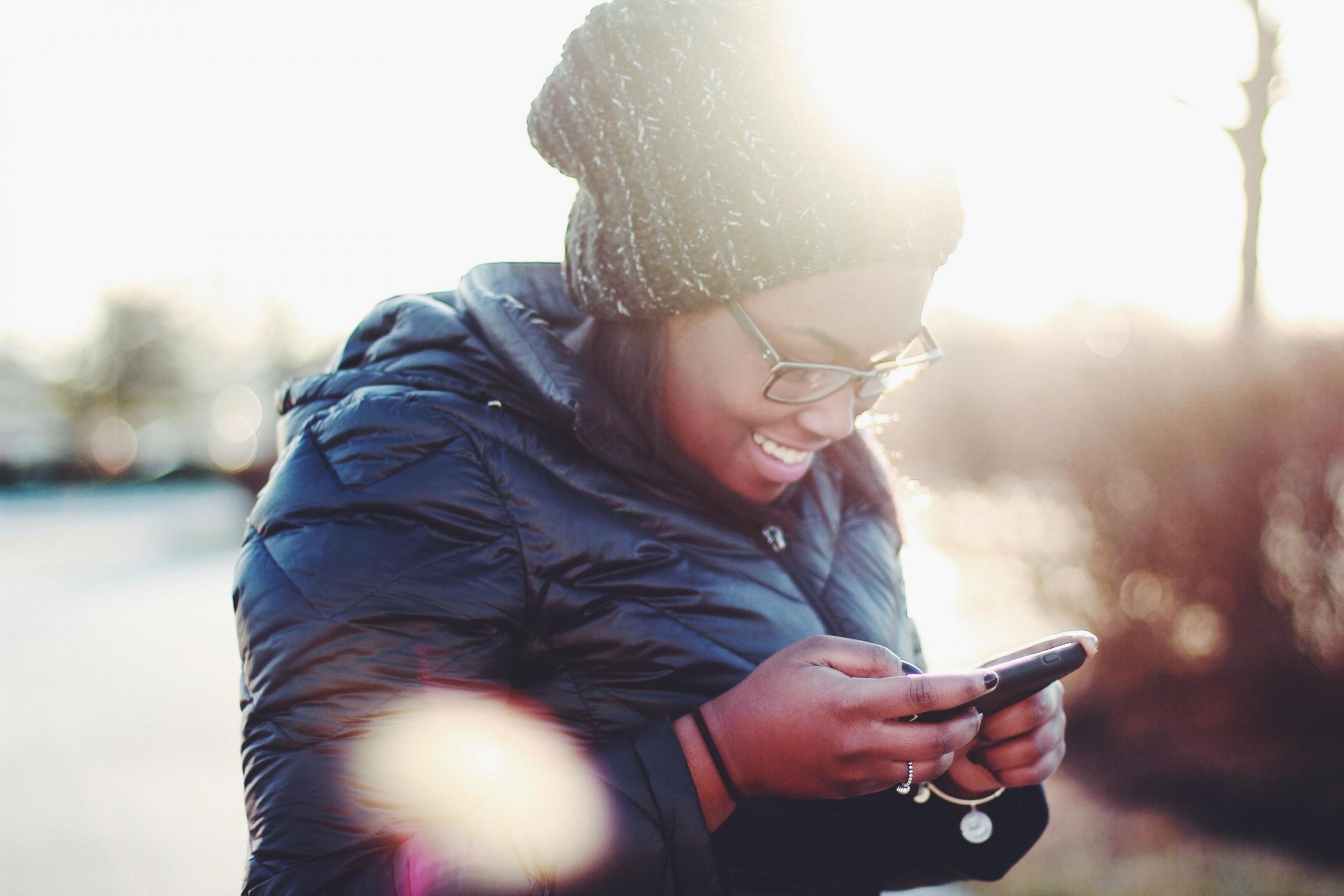 woman using smartphone outdoors