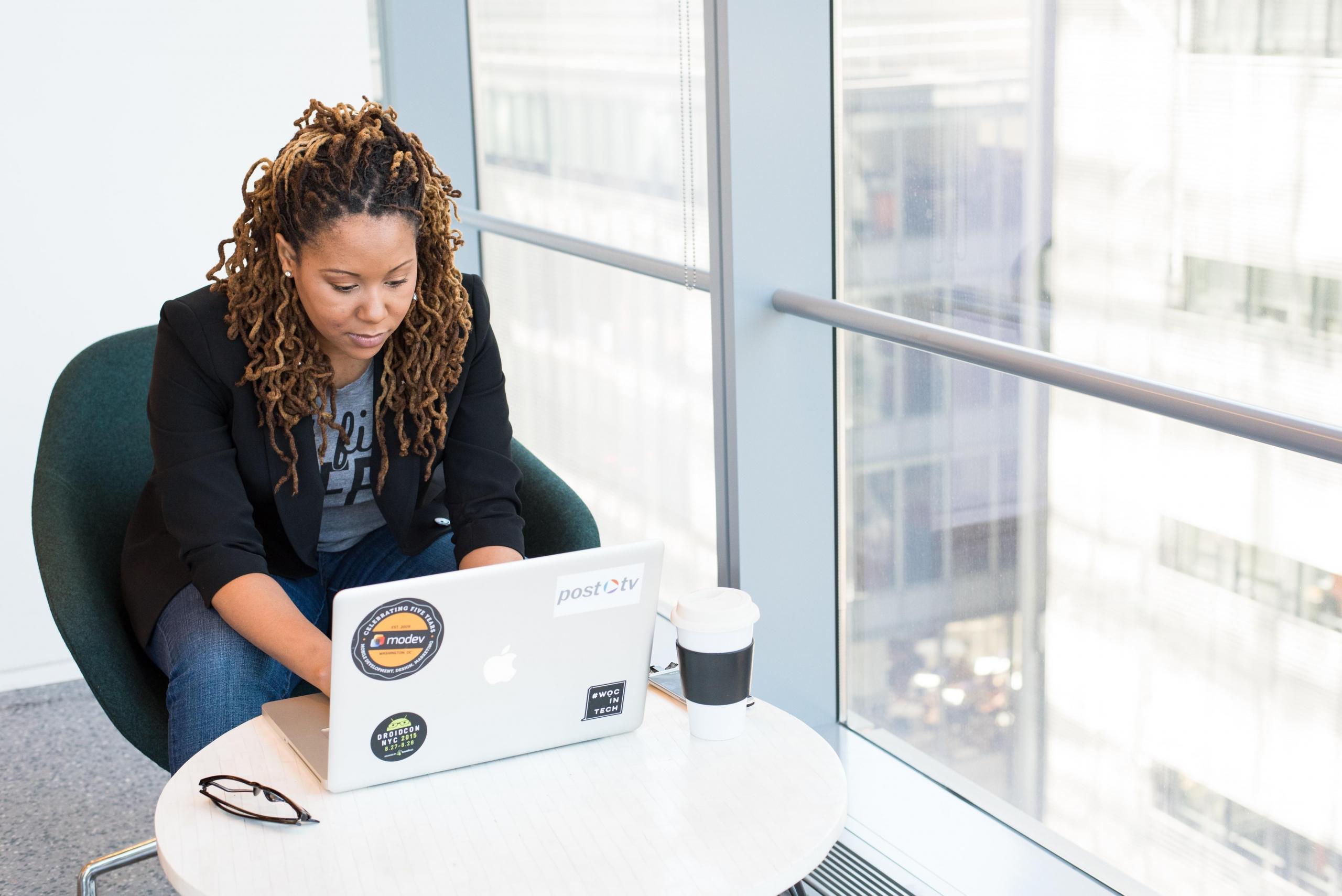 woman using laptop in office