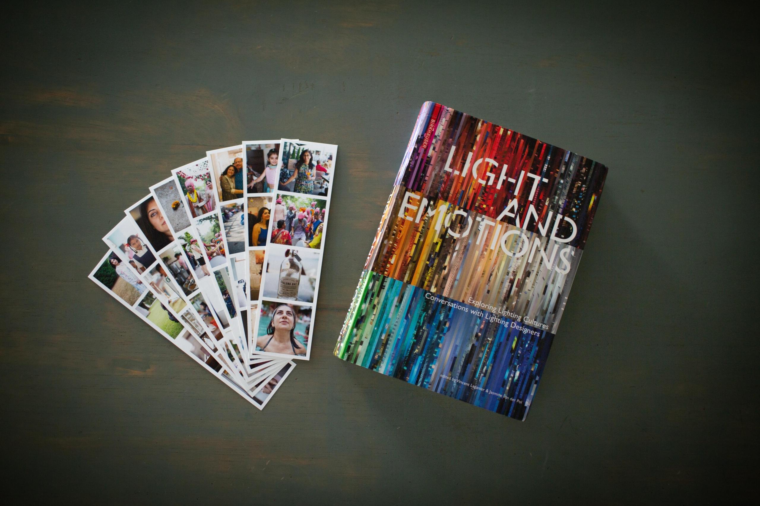 flat lay of photo prints and book