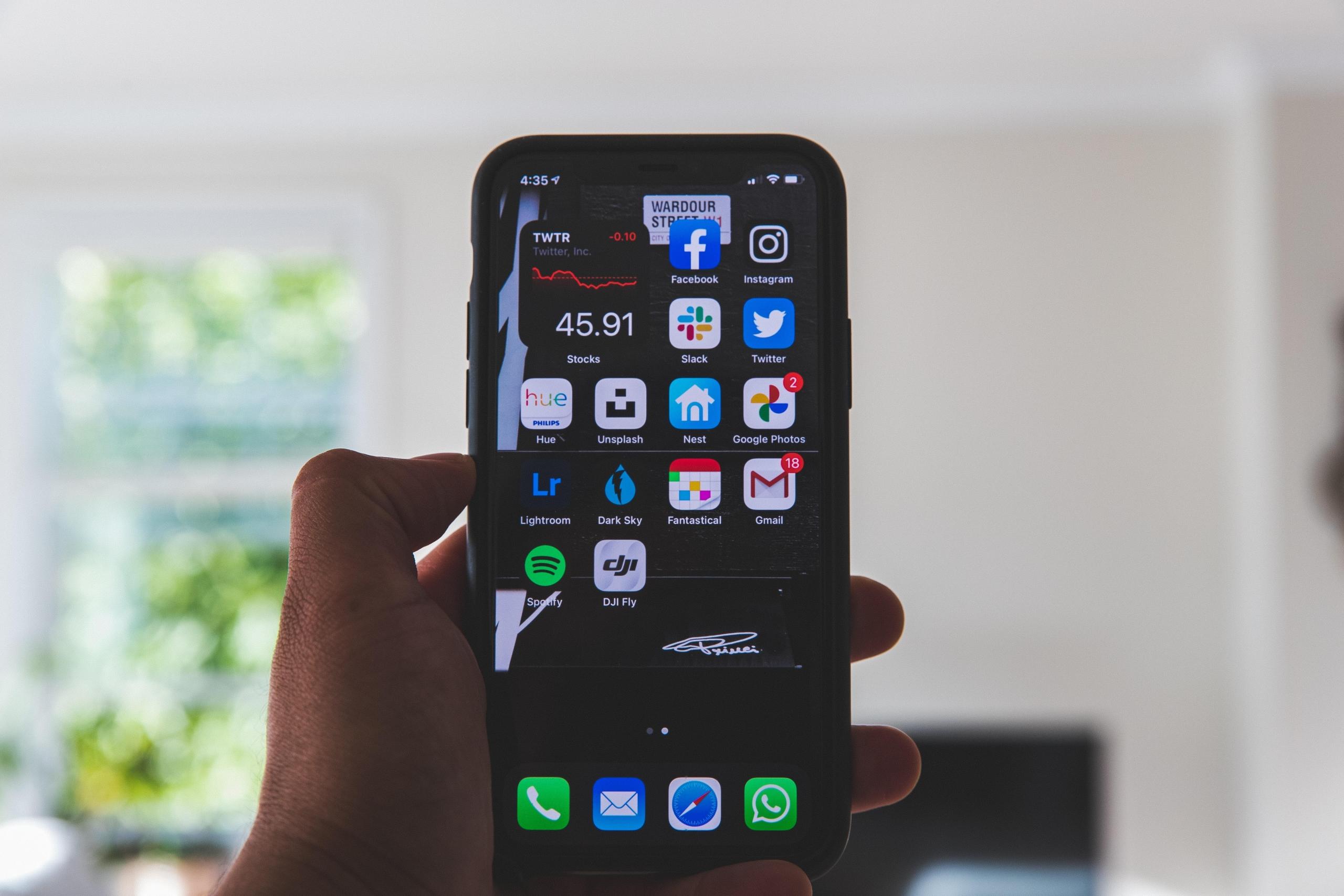 person holding black phone