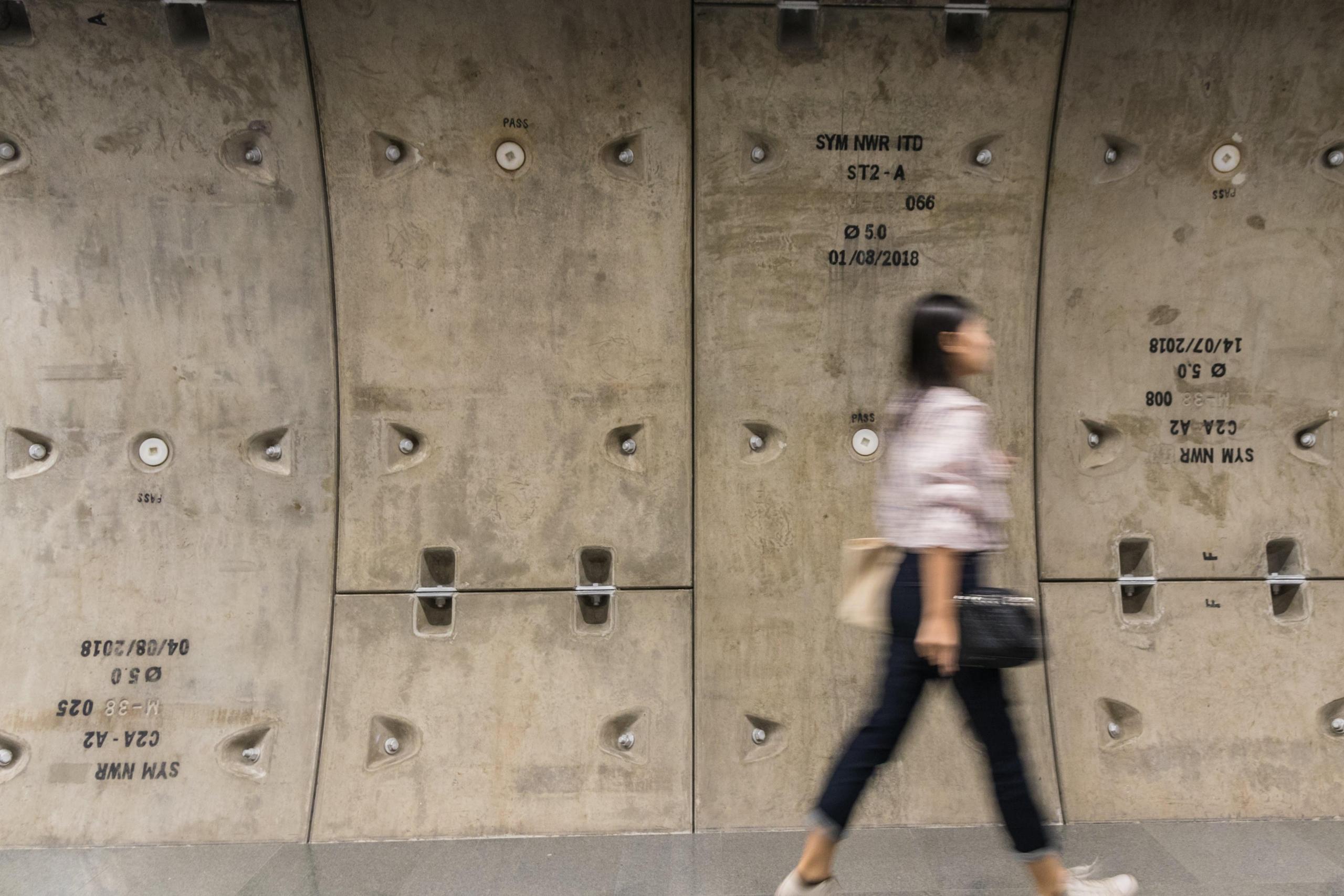 blurred photo of woman in tunnel