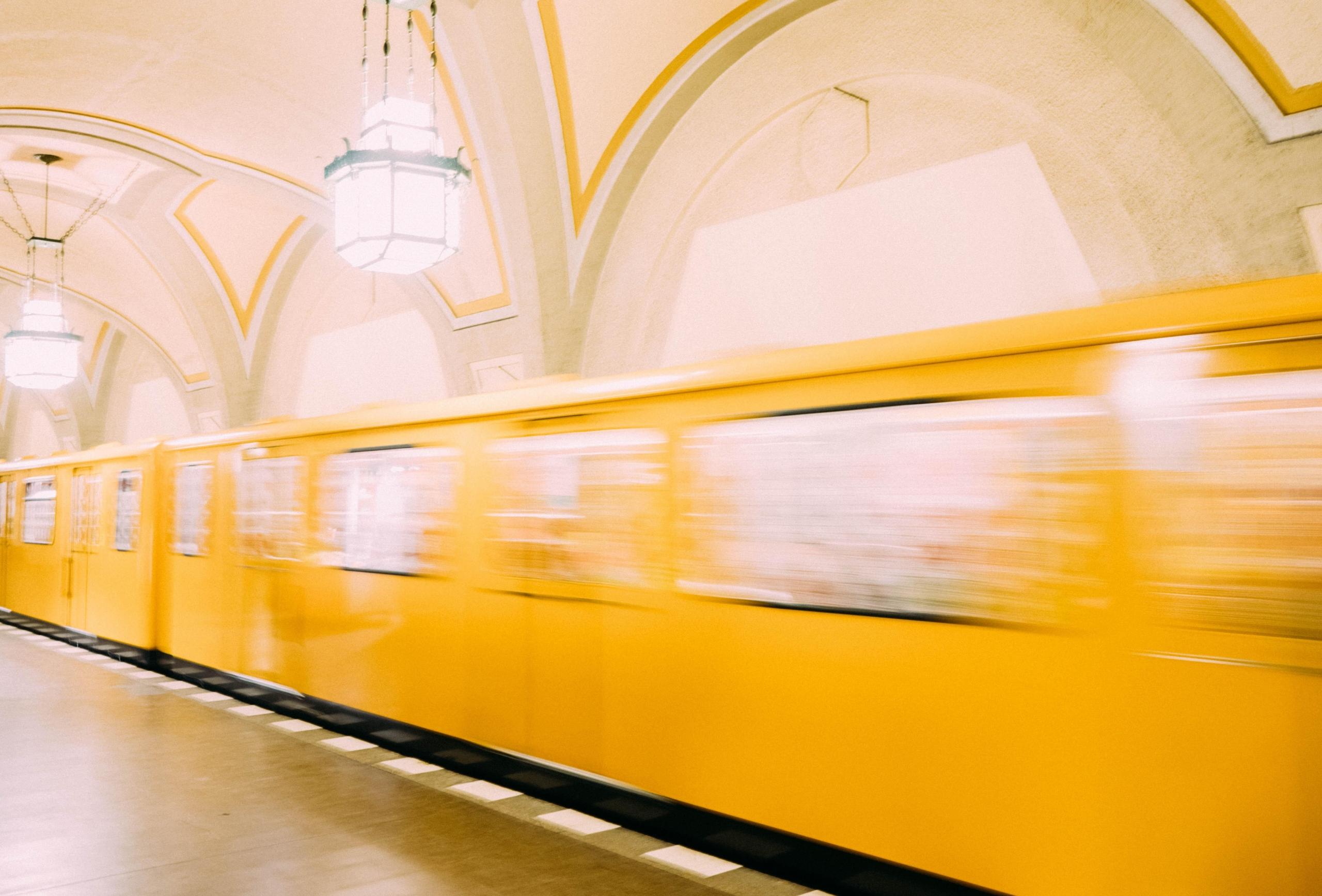 blurred photo of yellow train