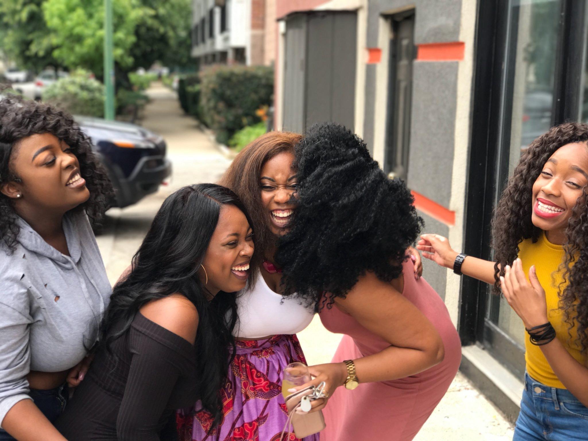 a group of female friends laughing together