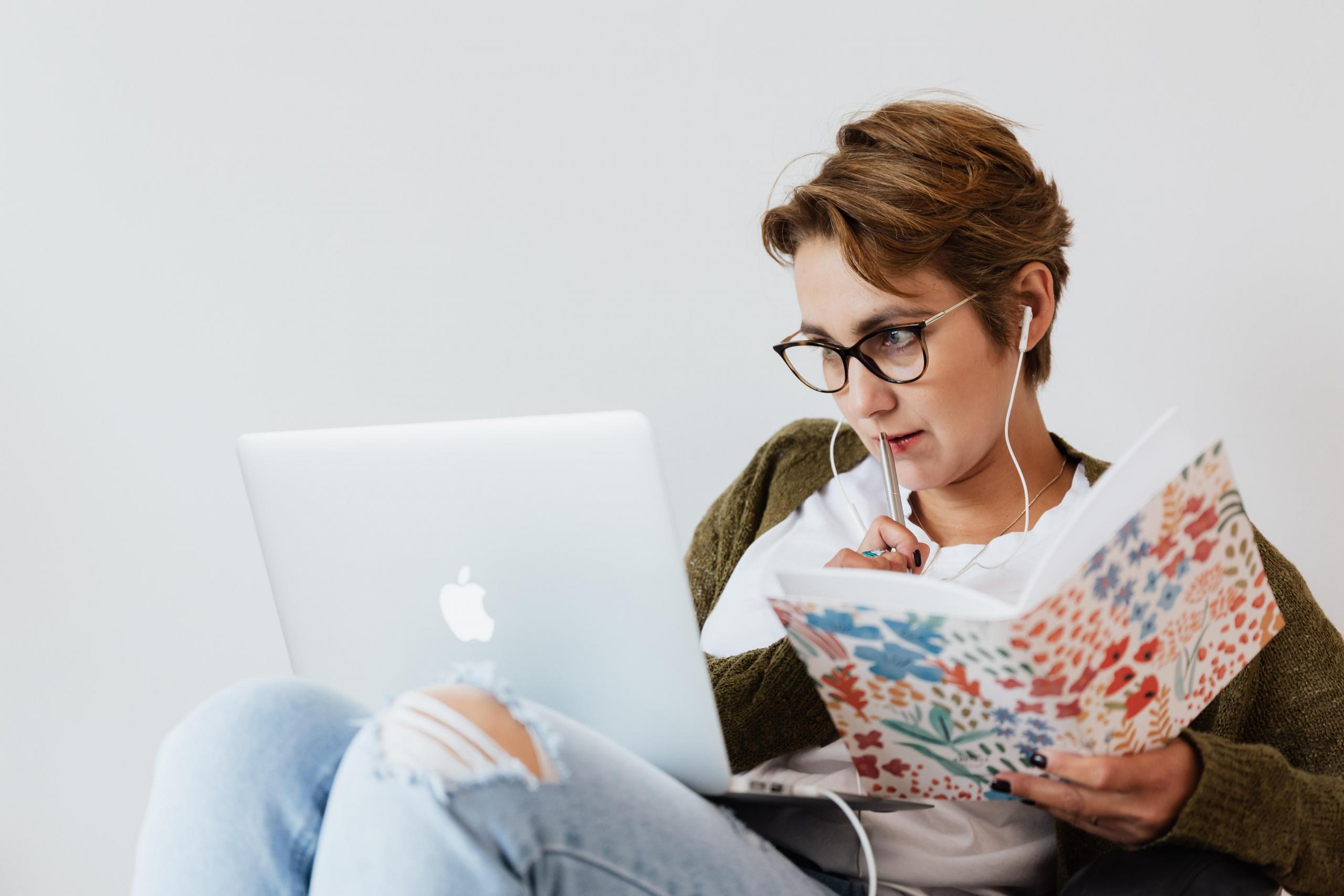 girl studying with laptop and notebook
