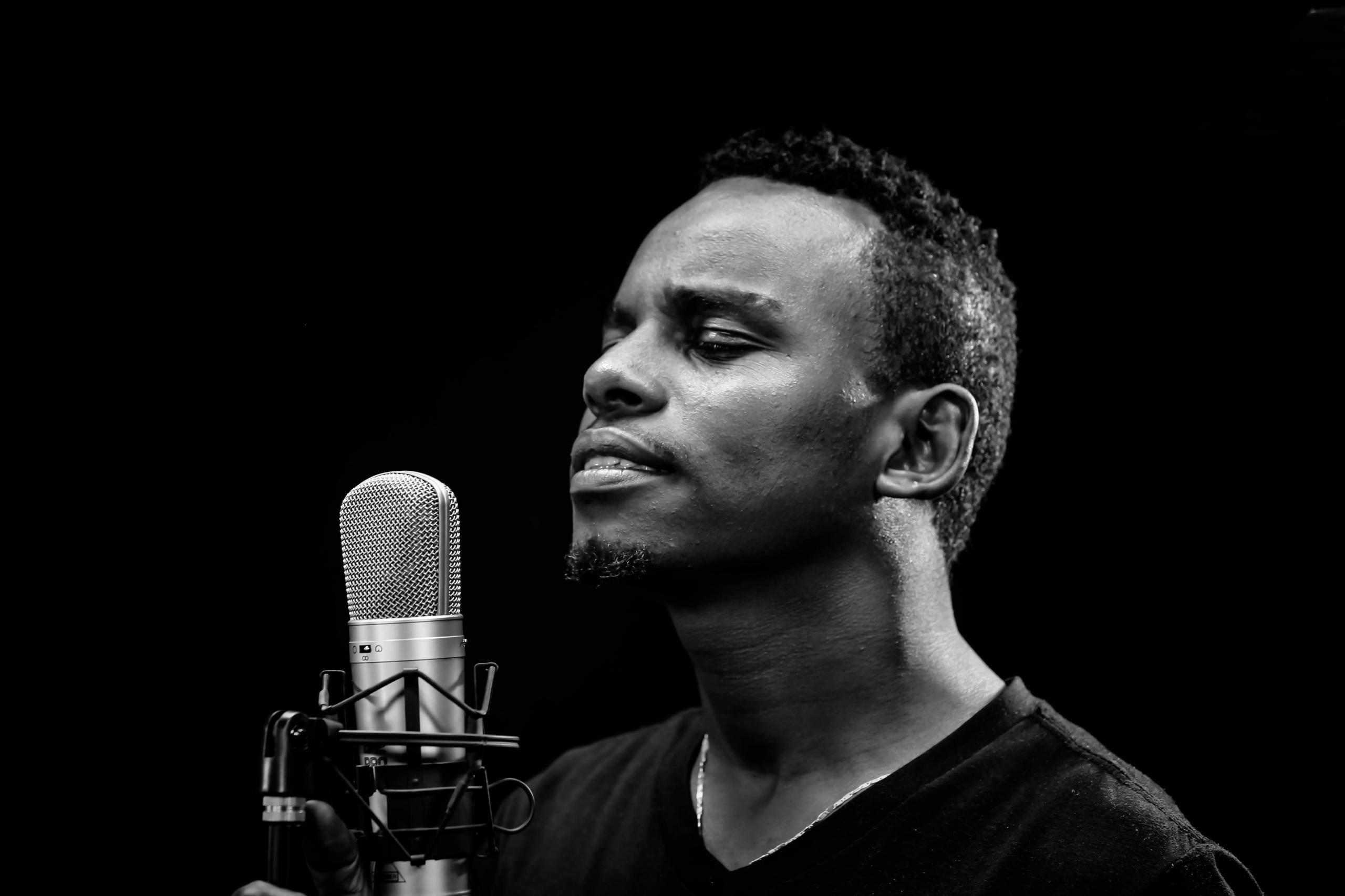 man singing into microphone