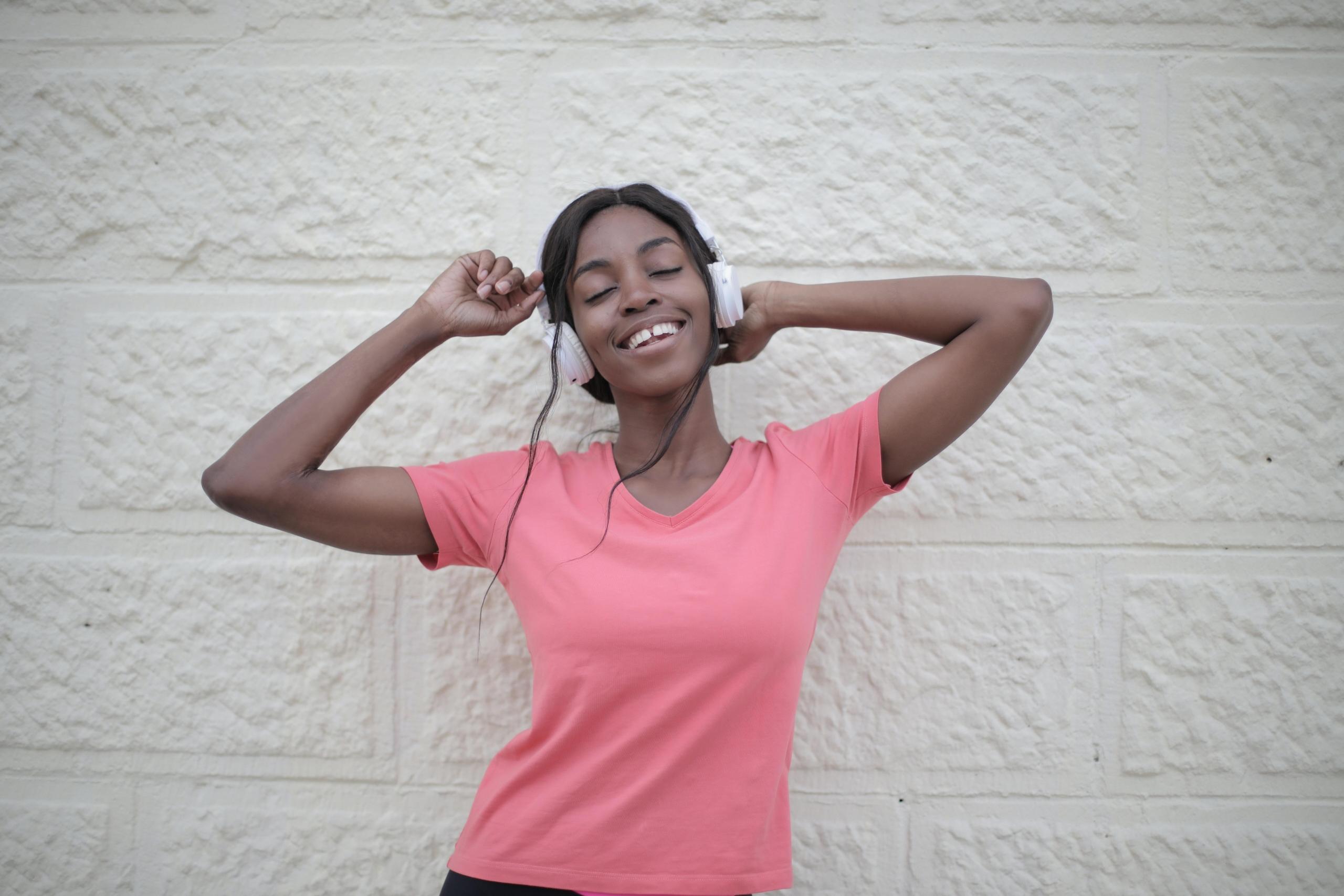 woman listening music with headphones