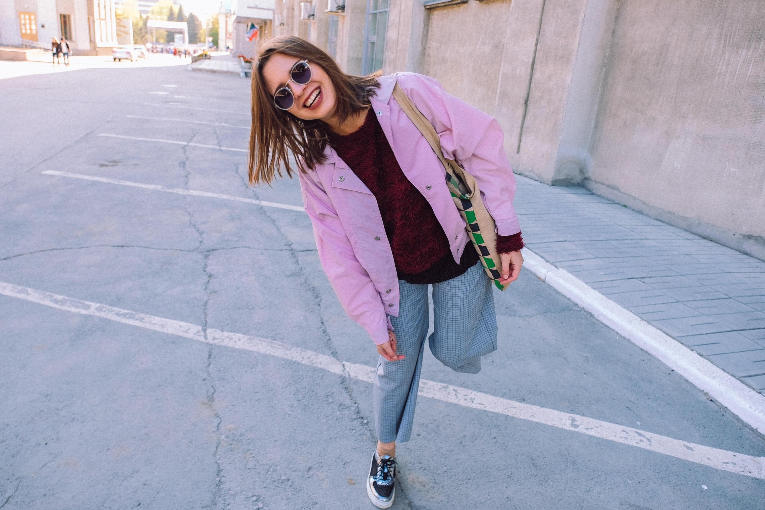 woman in the street, smiling