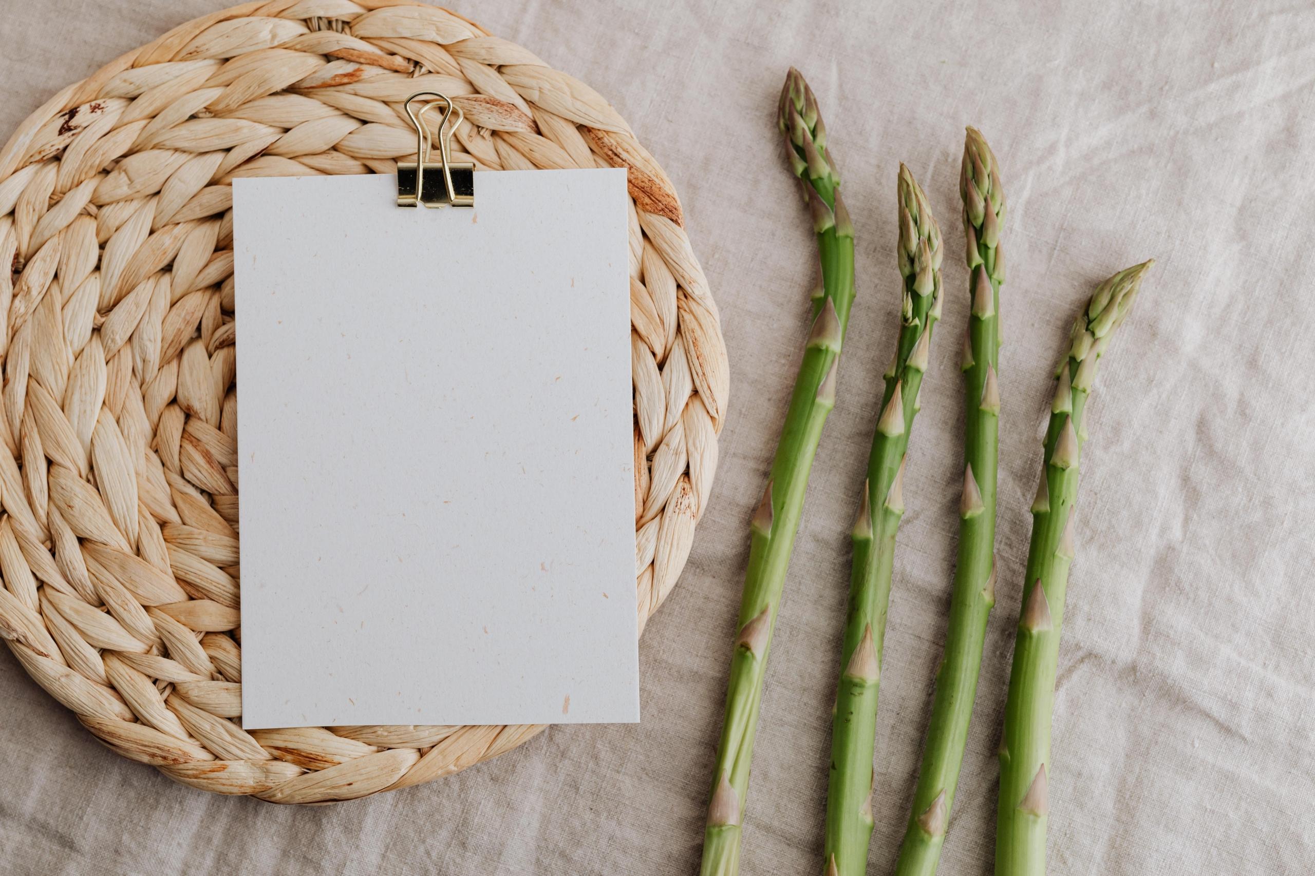 notepaper on placemat next to asparagus