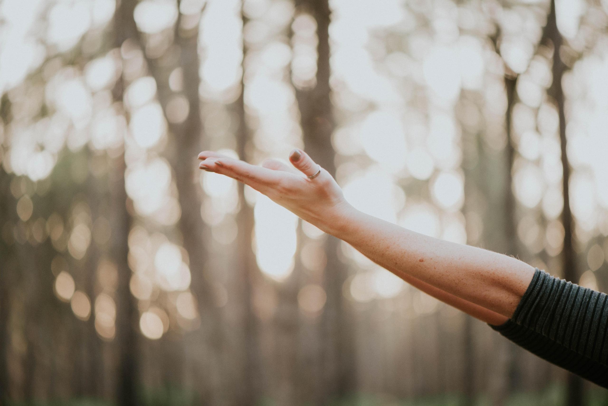 person with outstretched arms