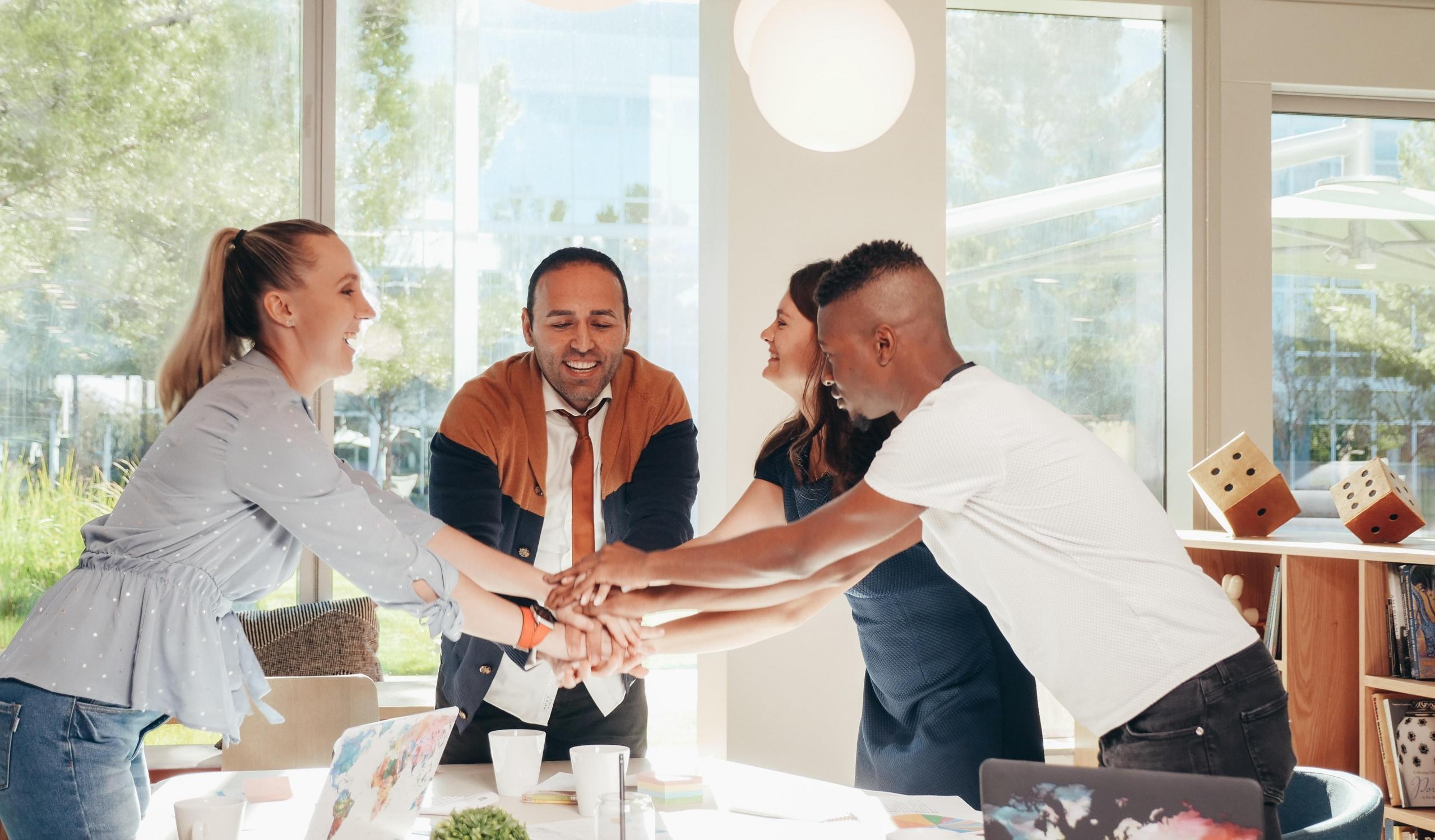 team putting hands together