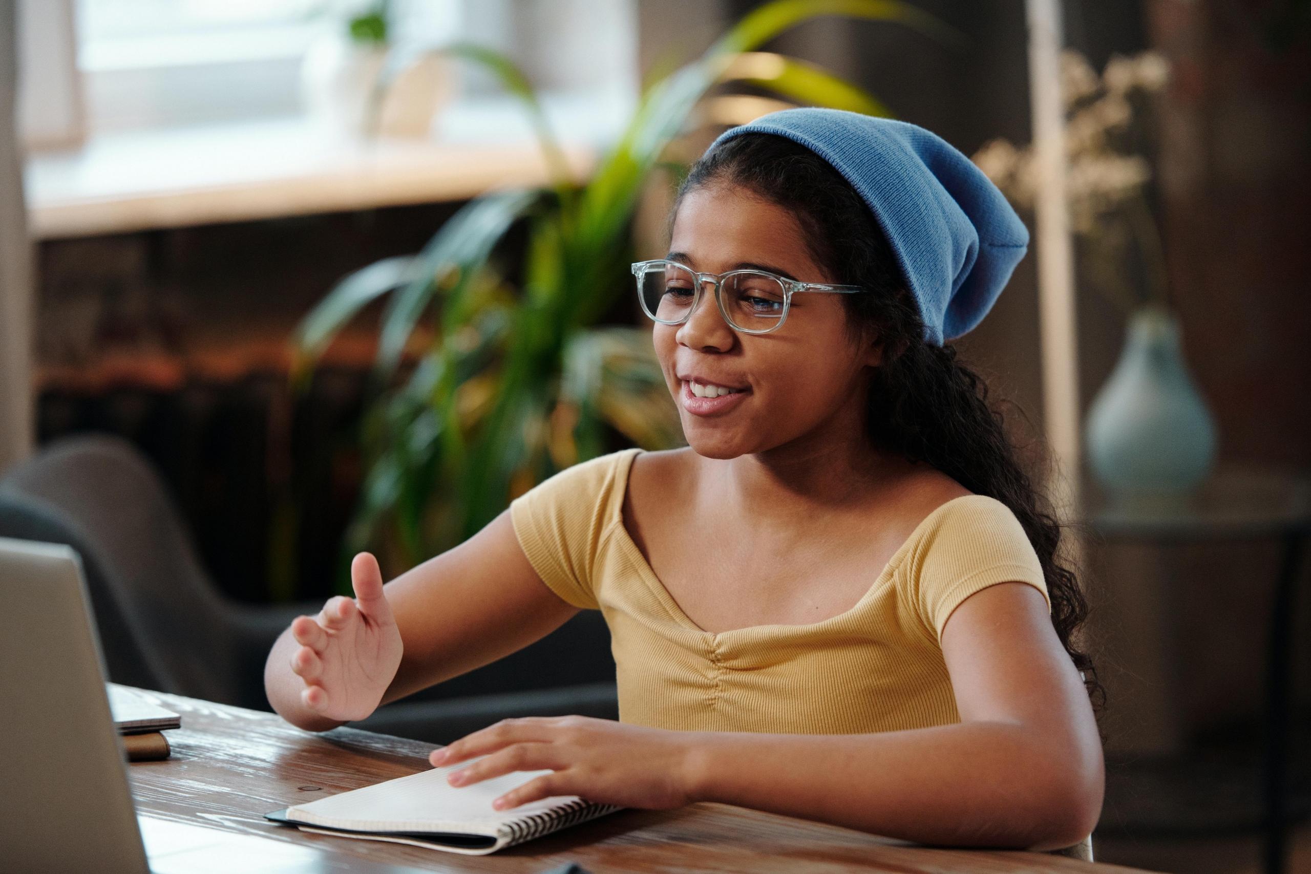 girl doing homework online