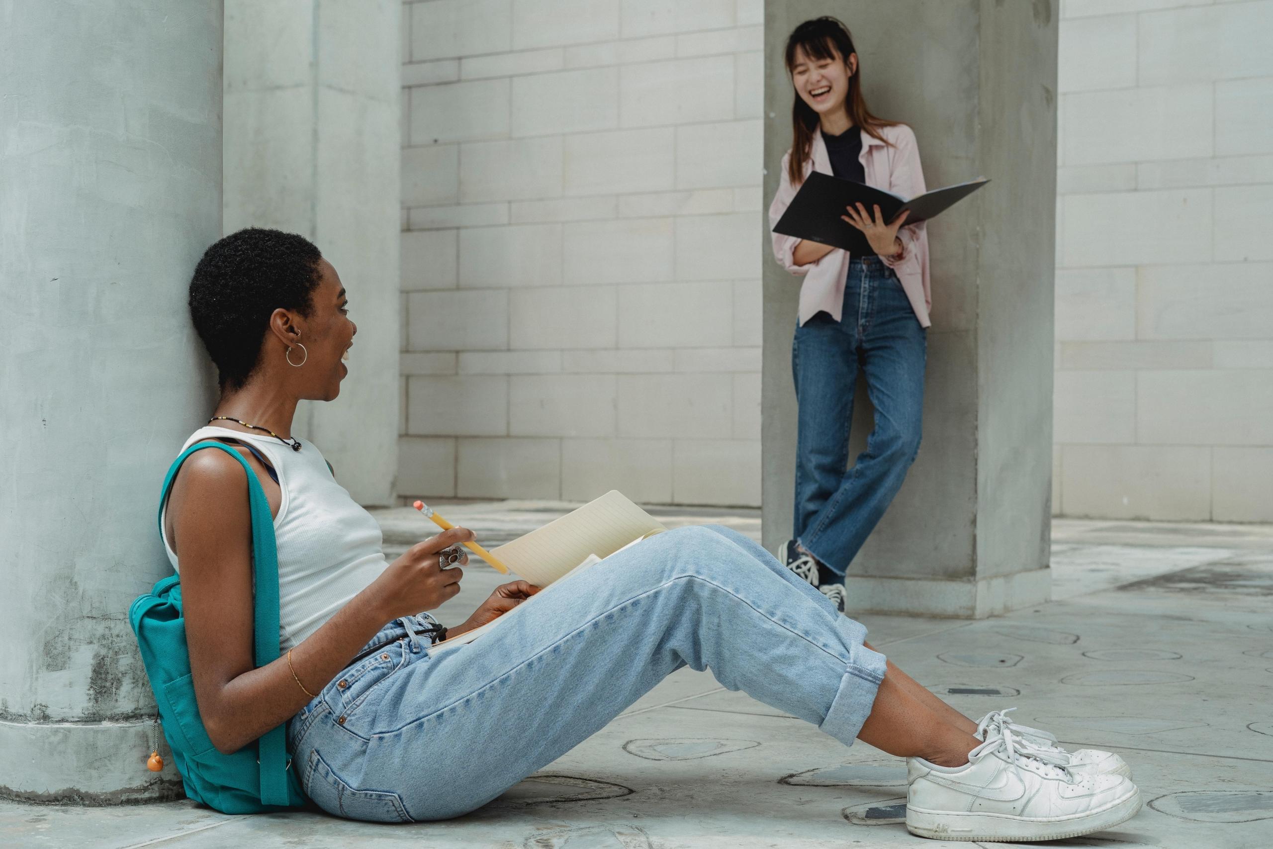 two young woman revising