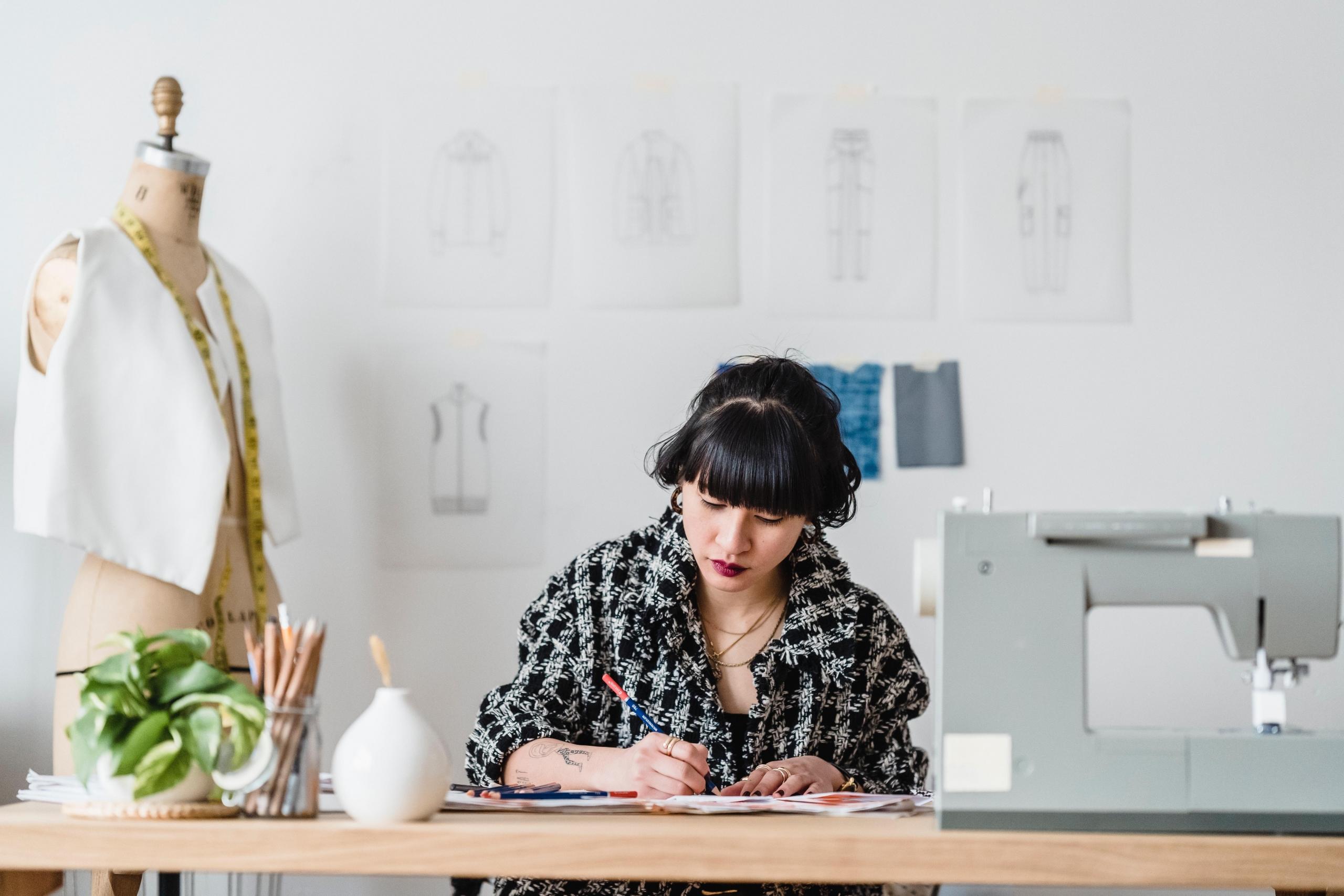woman creating fashion designs