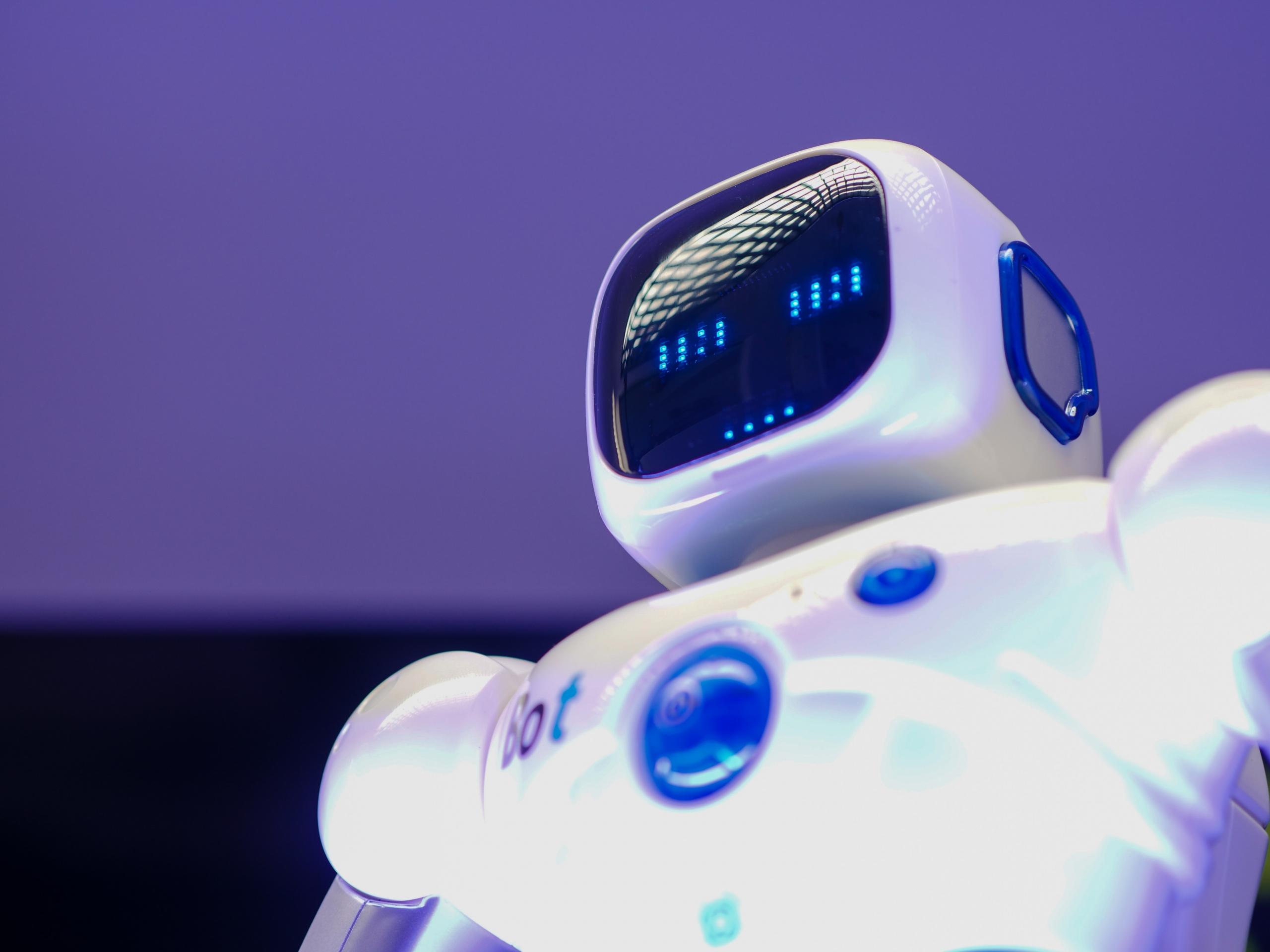 close-up of AI bot in front of purple background