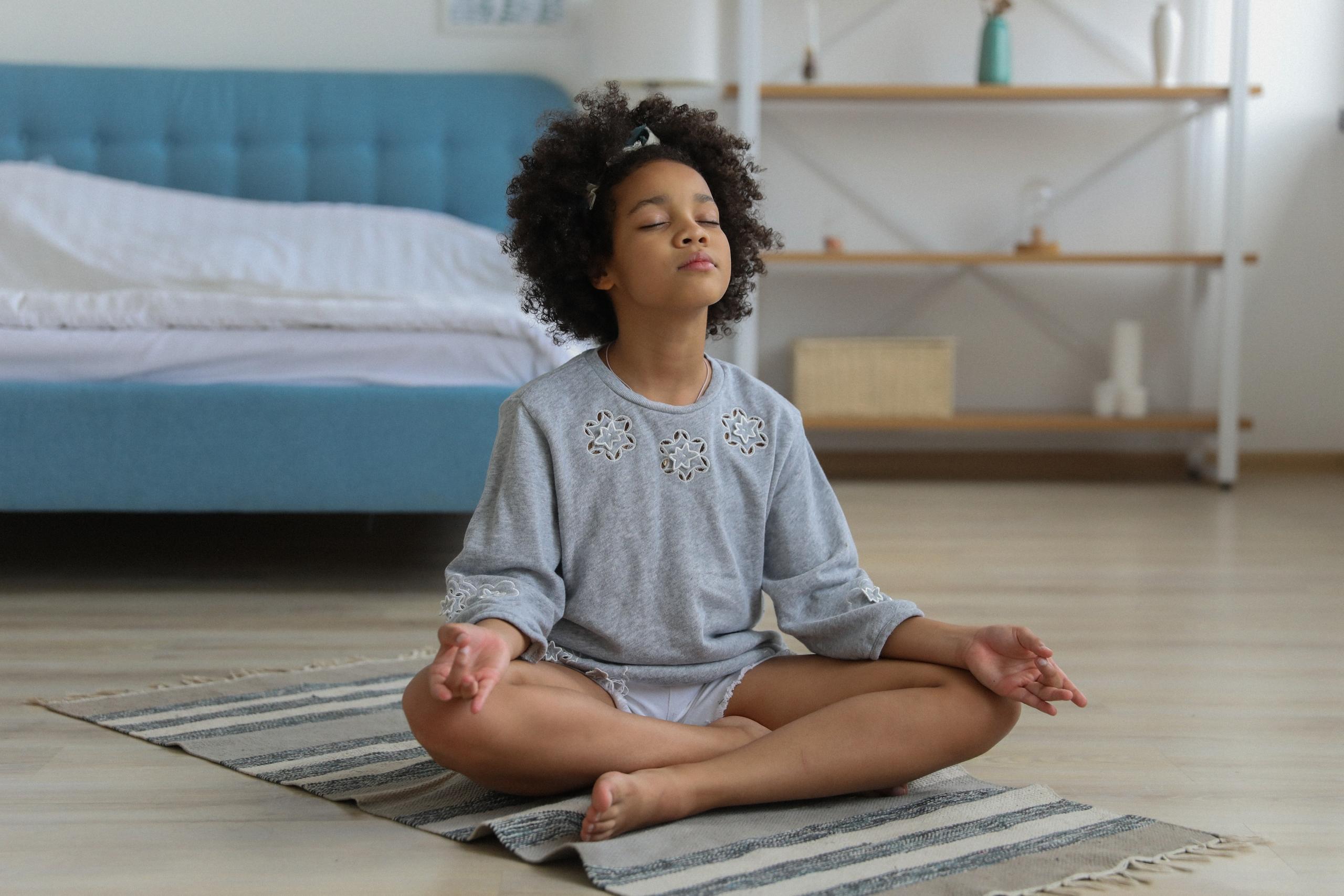 little girl practising meditation