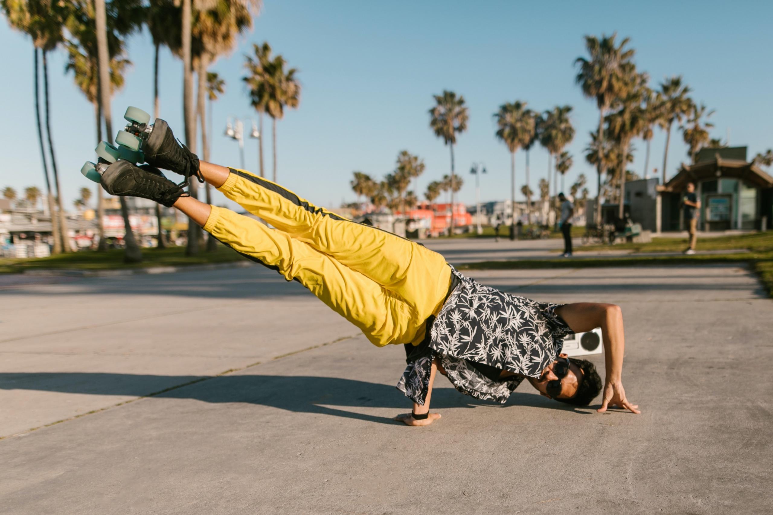 man rollerskating and breakdancing