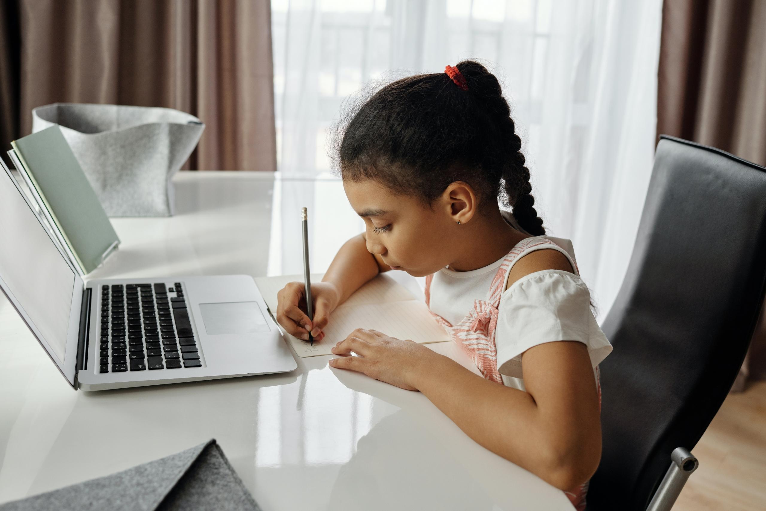 school student revising at desk