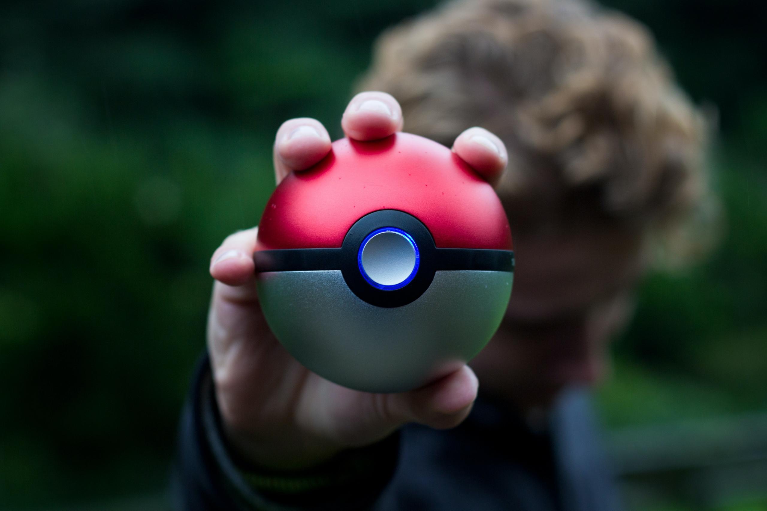 man holding pokeball