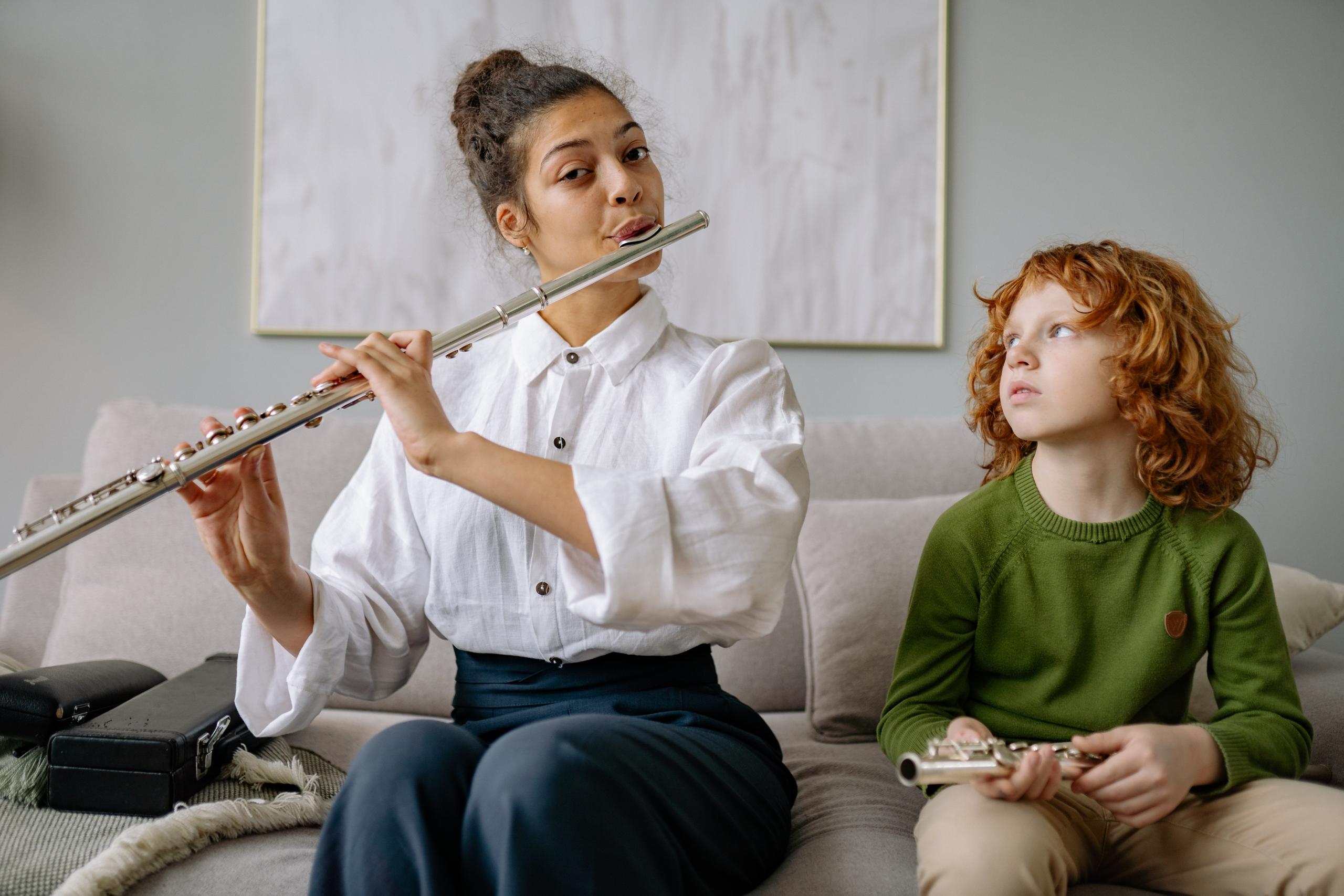 flute teacher teaching music student