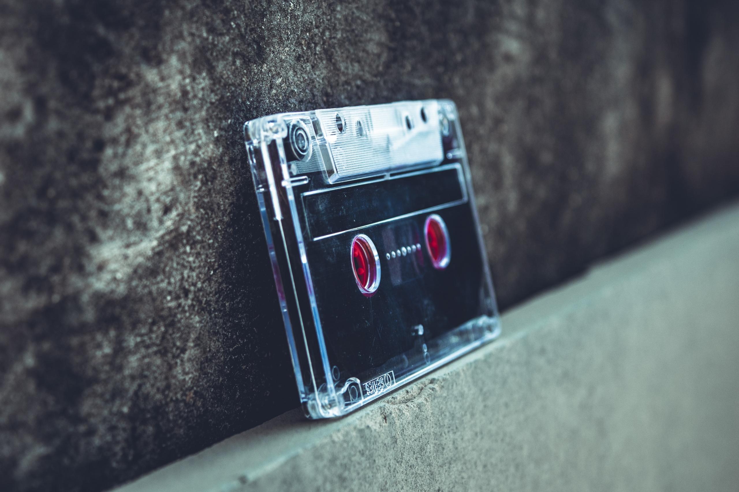 compact cassette balanced on narrow ledge