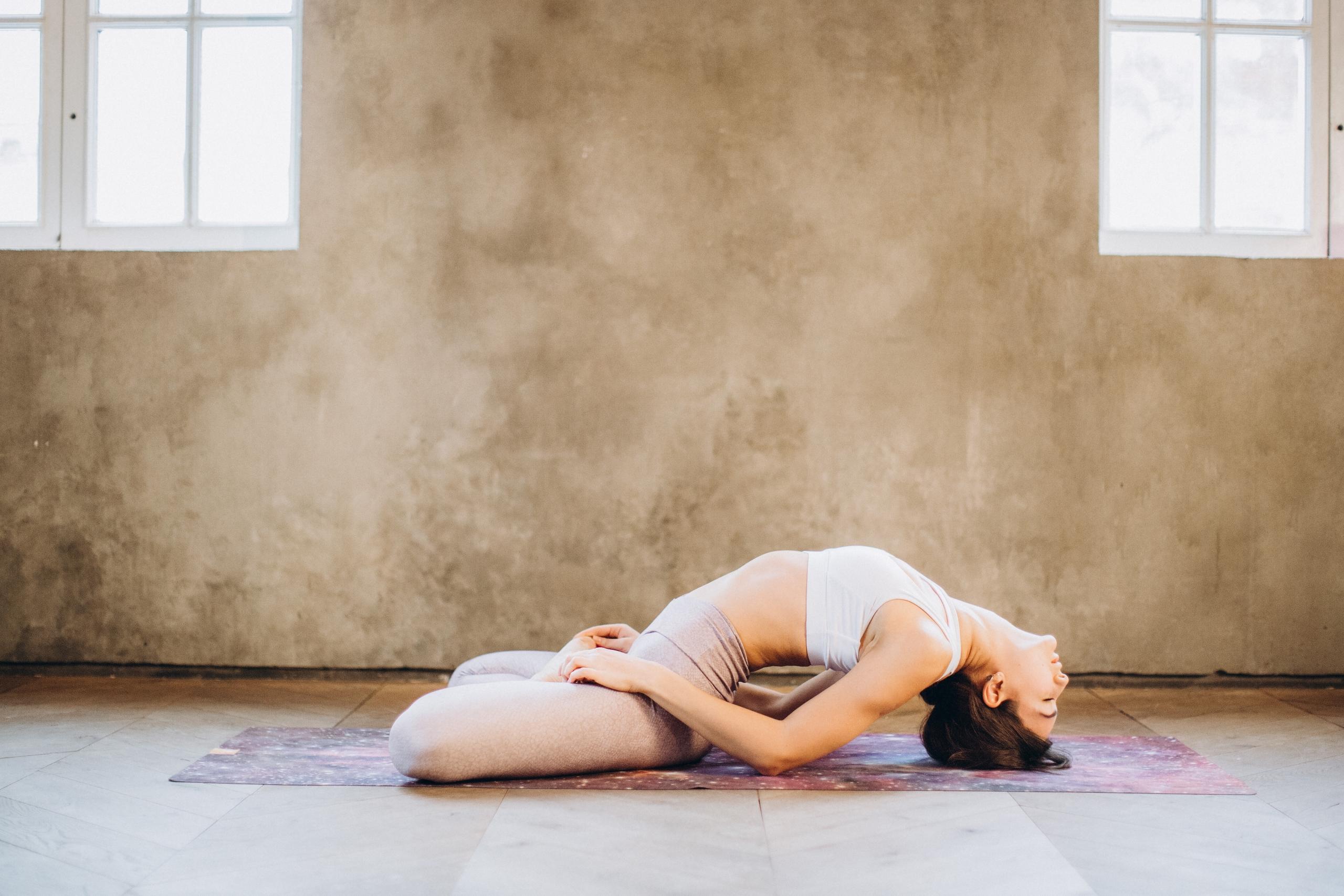 woman doing seated backward bend