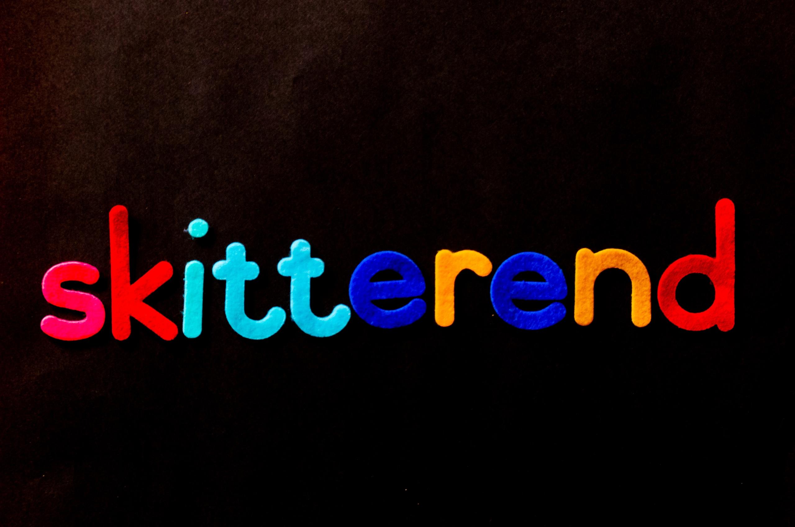afrikaans word in felt letters on black background