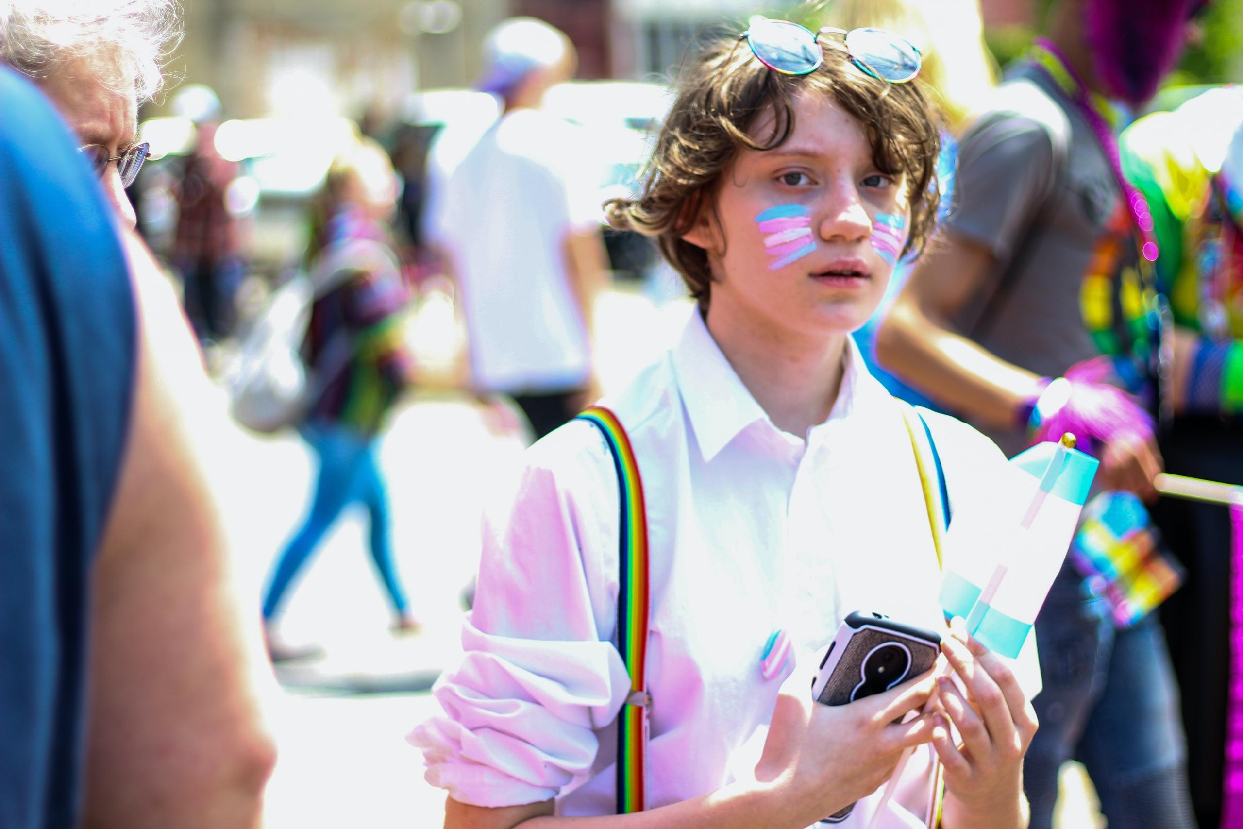 child wearing pride rainbow braces