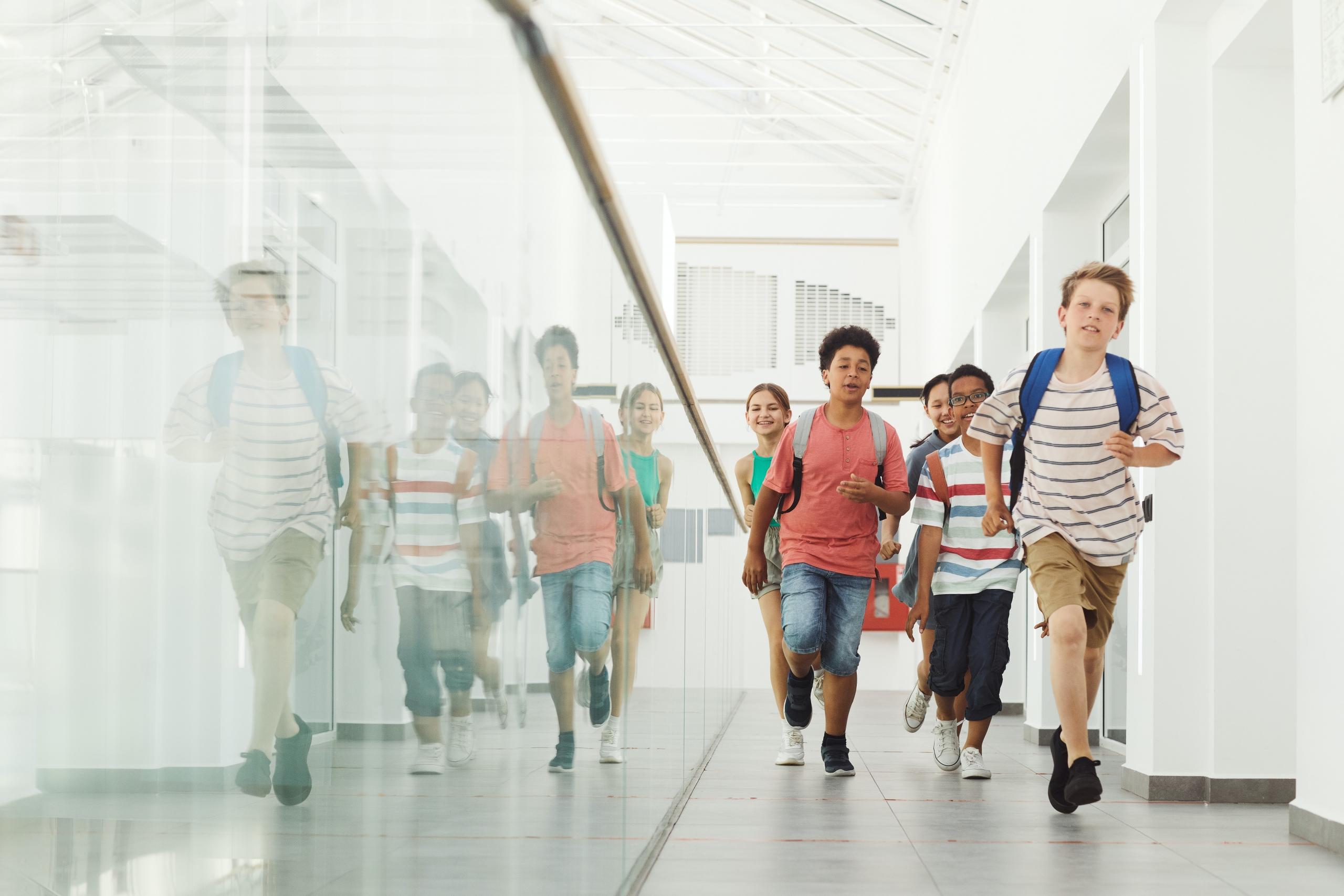 school kids walking down corridor