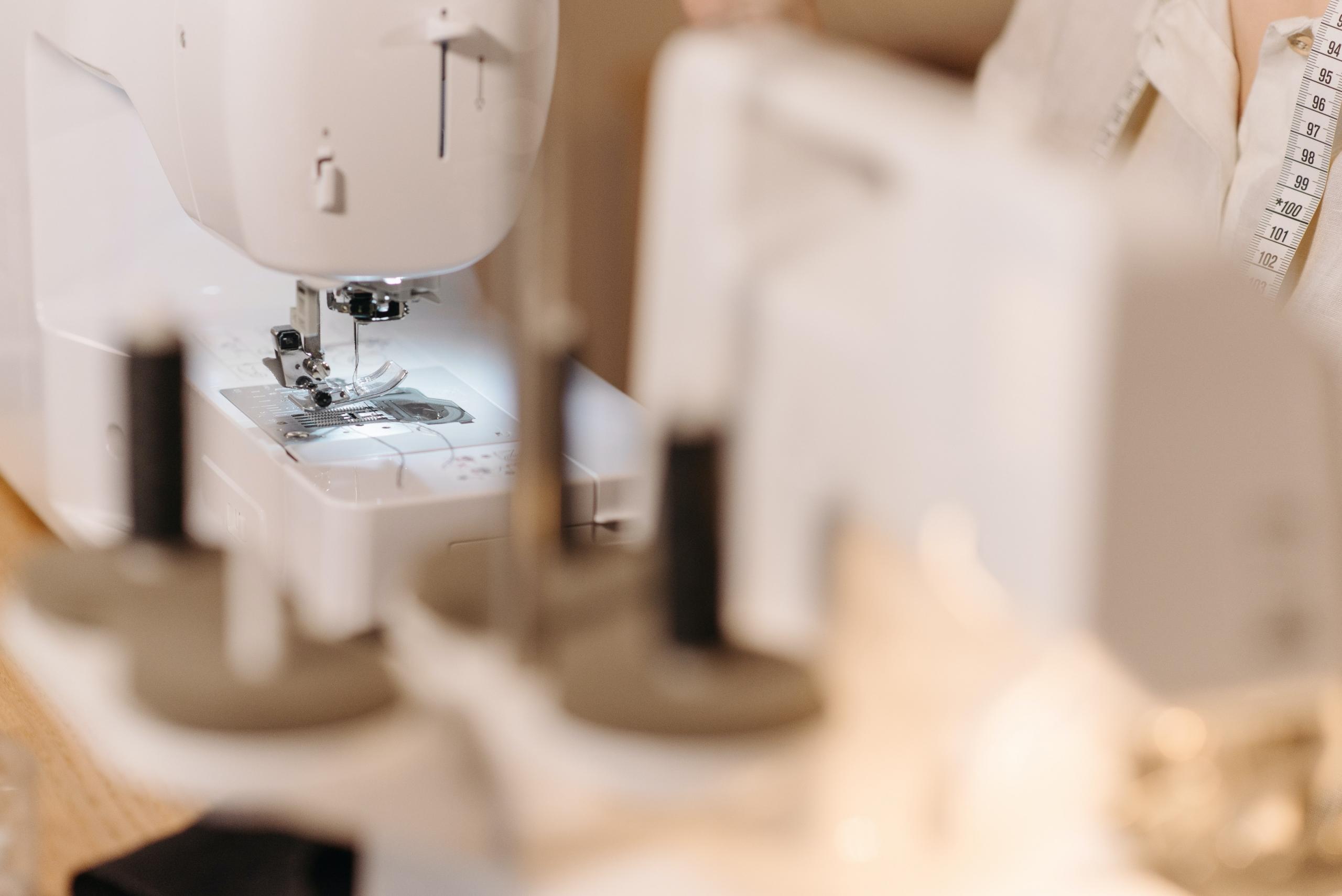 slightly out of focus white sewing machine