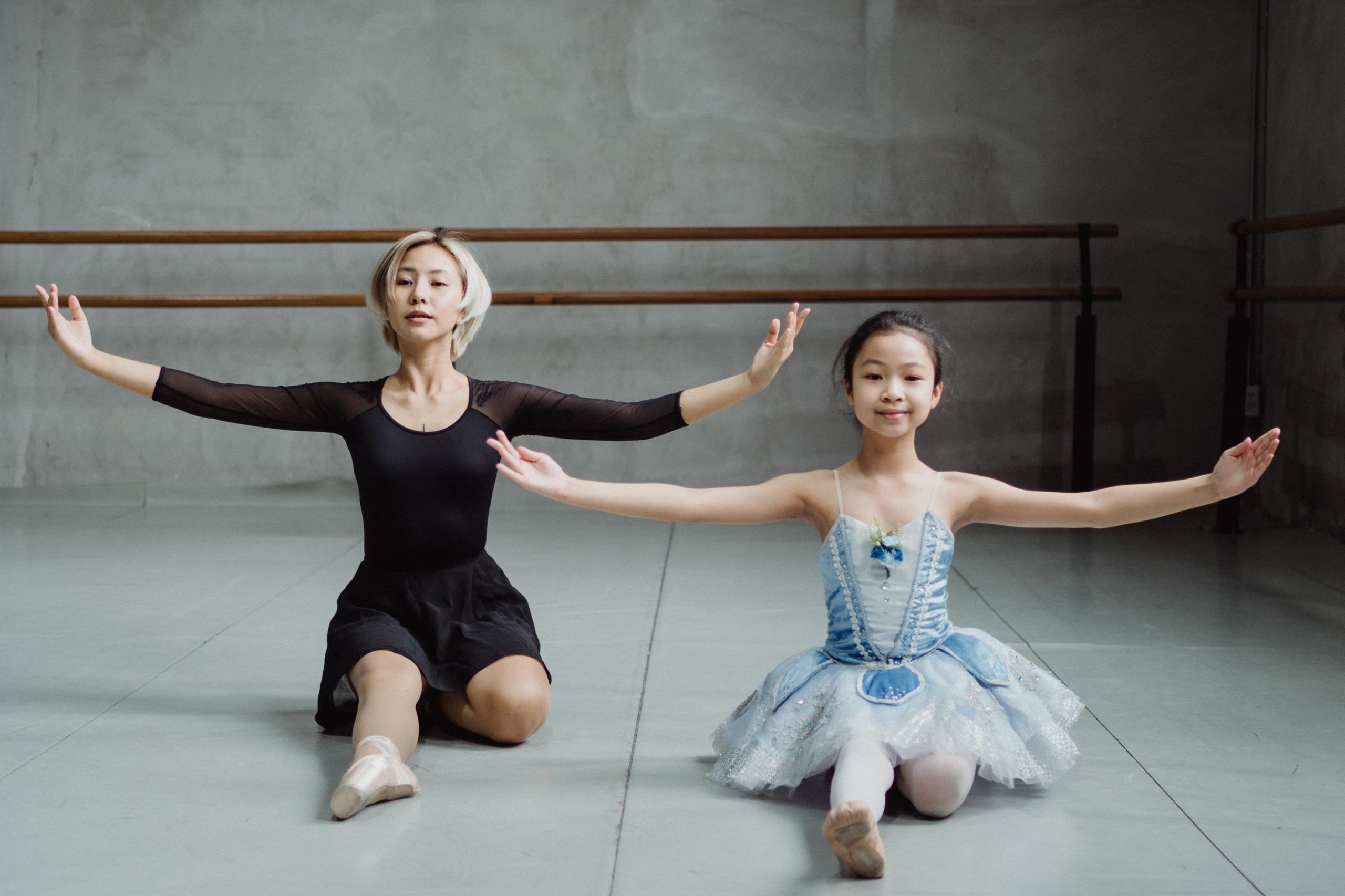 ballet instructor and student rehearsing