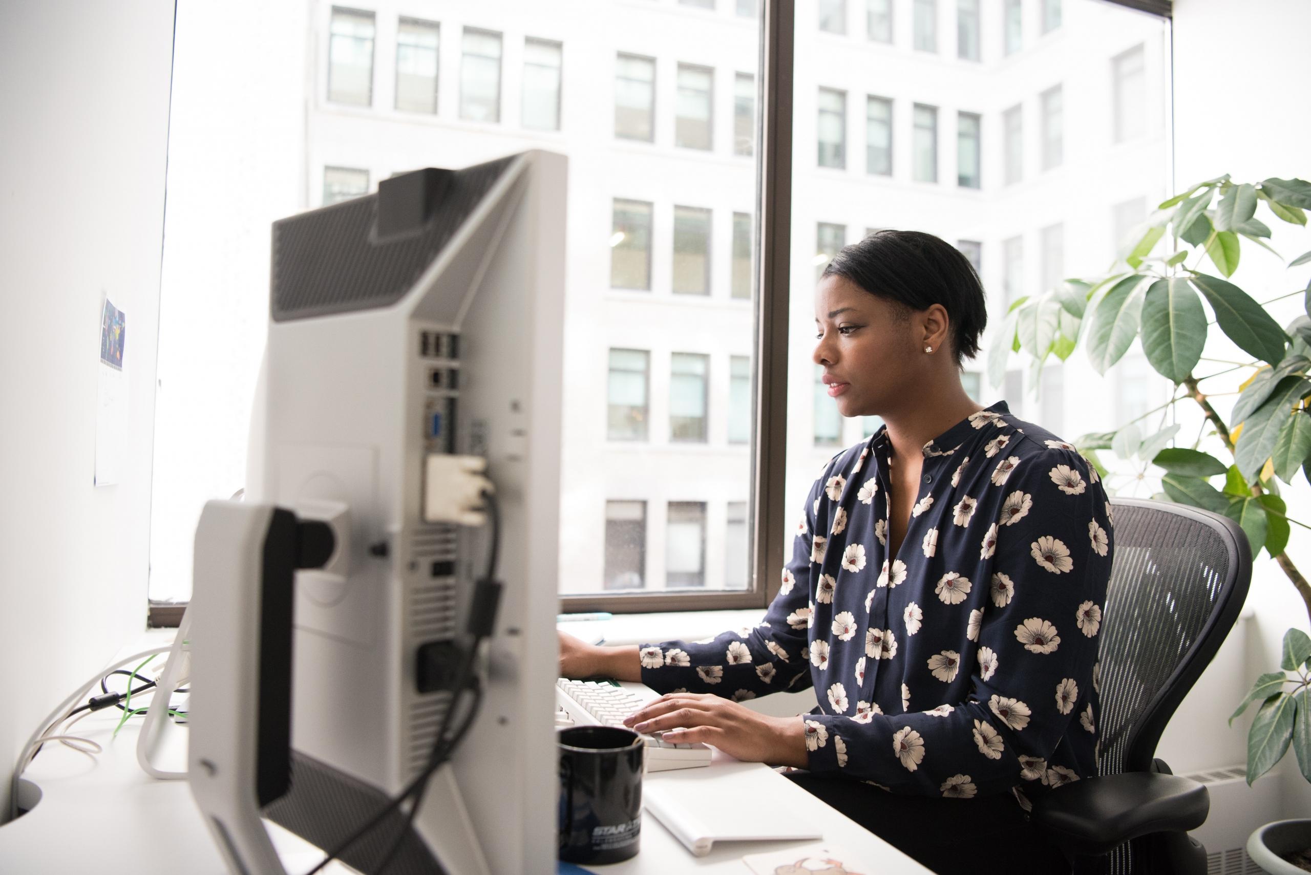 accountant working on computer in office