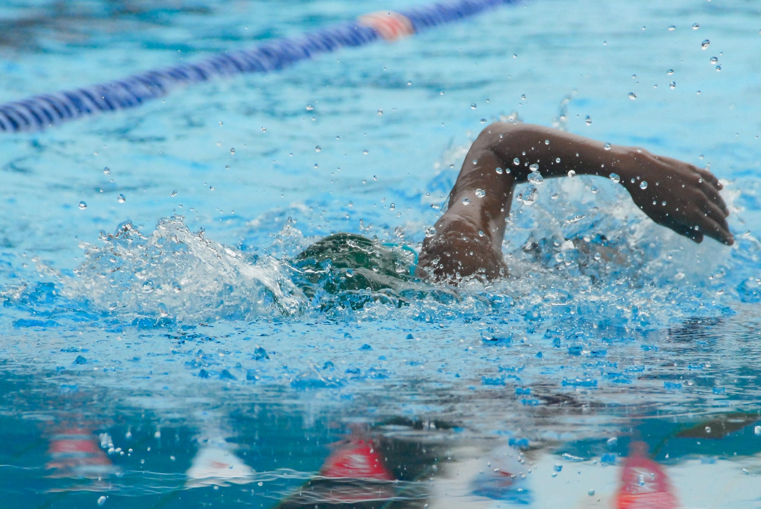 professional swimmer in swimming pool