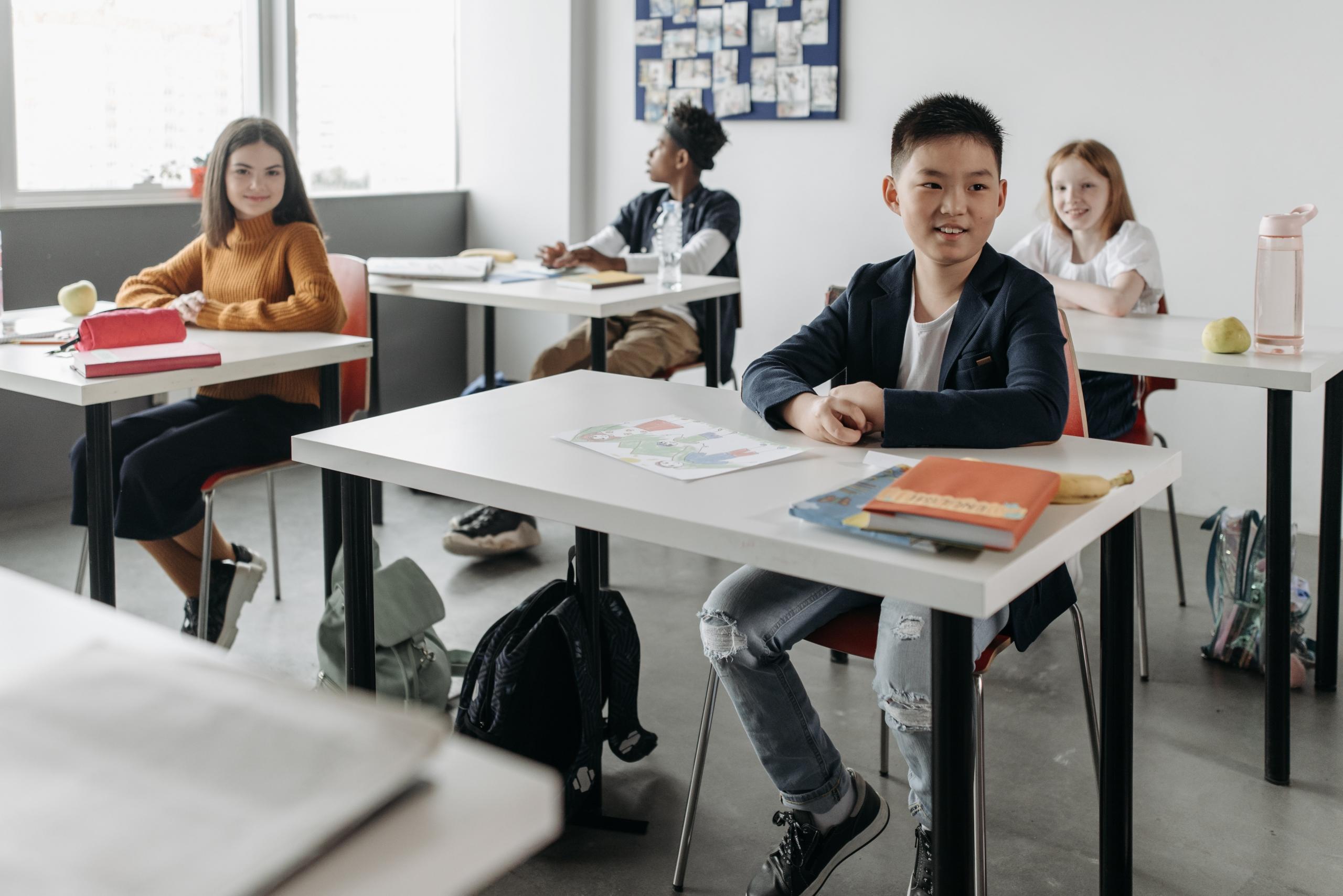students seated at desks in classroom