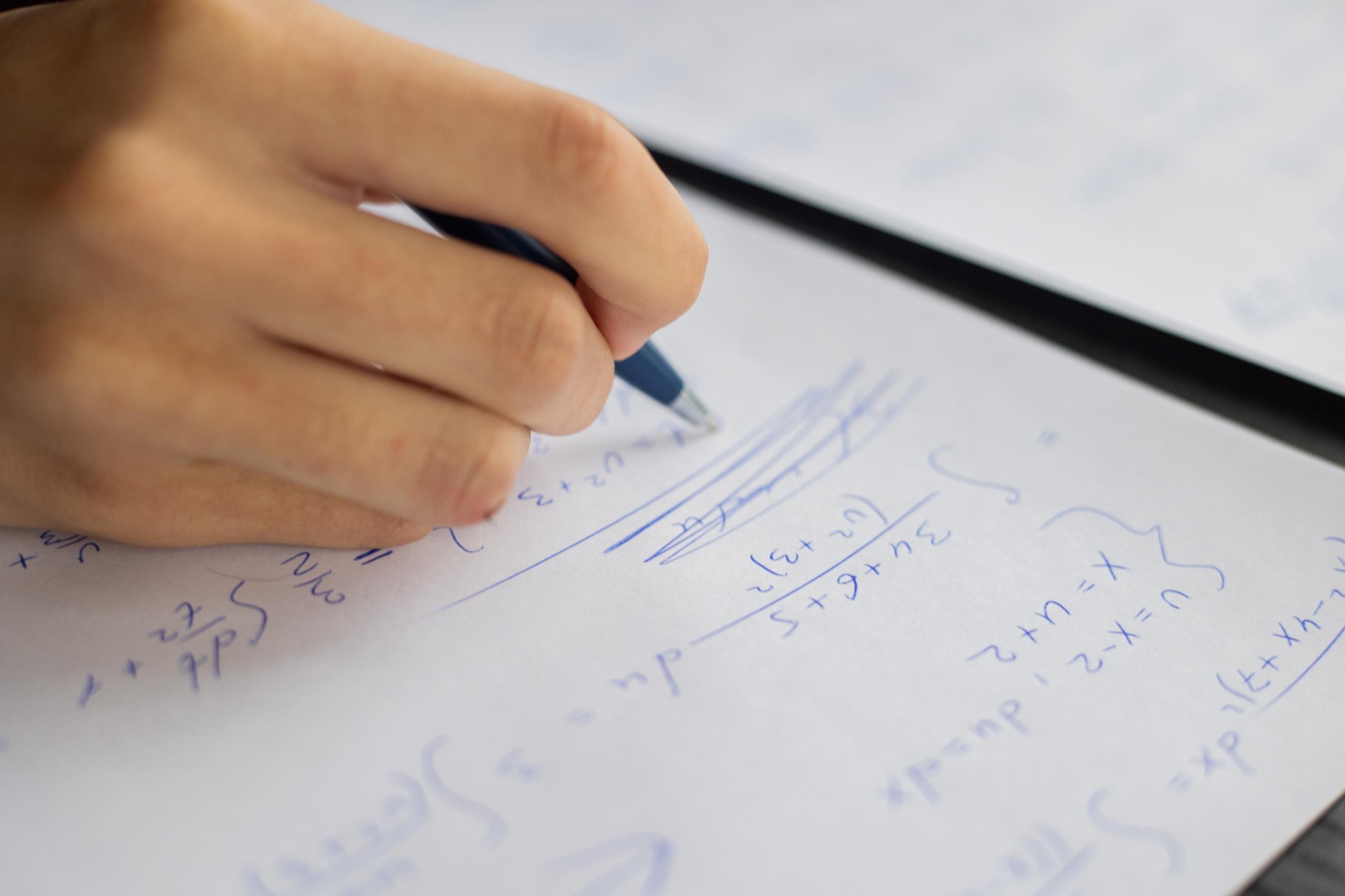 student working out algebra problems