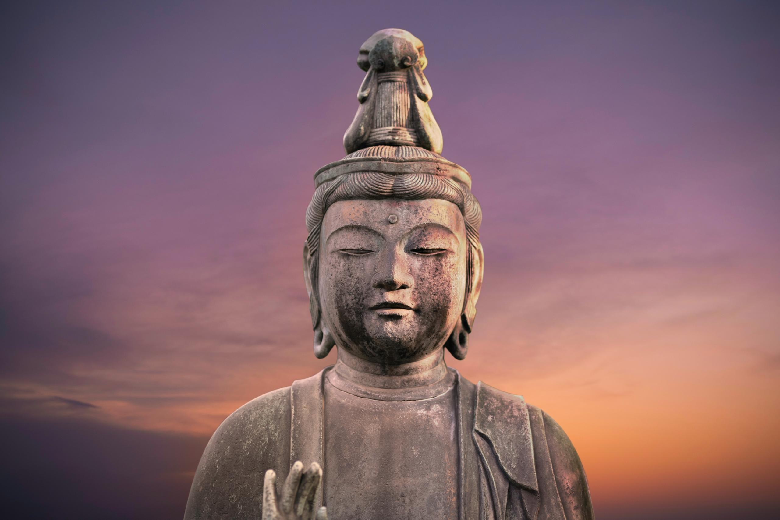 statue of buddha at dusk