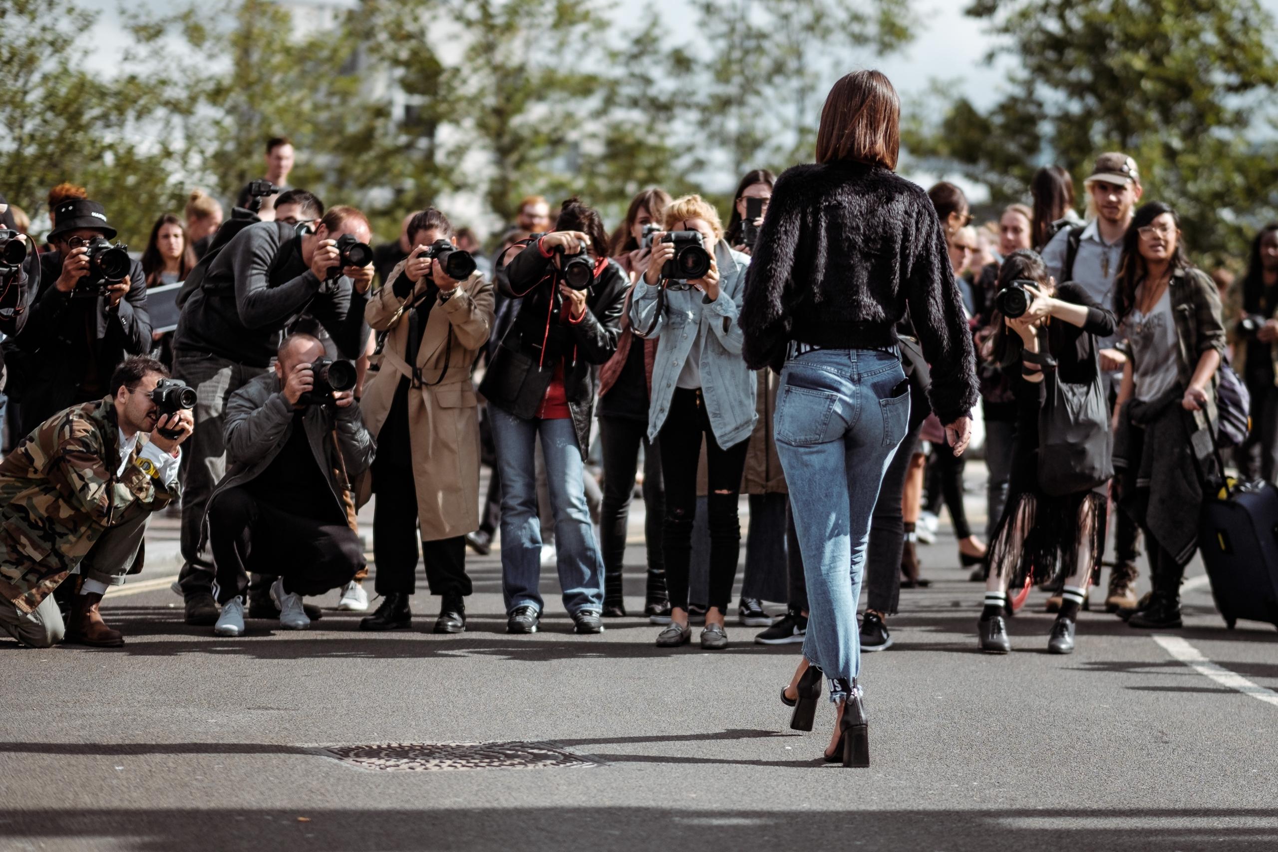 paparazzi photographing actress in the street