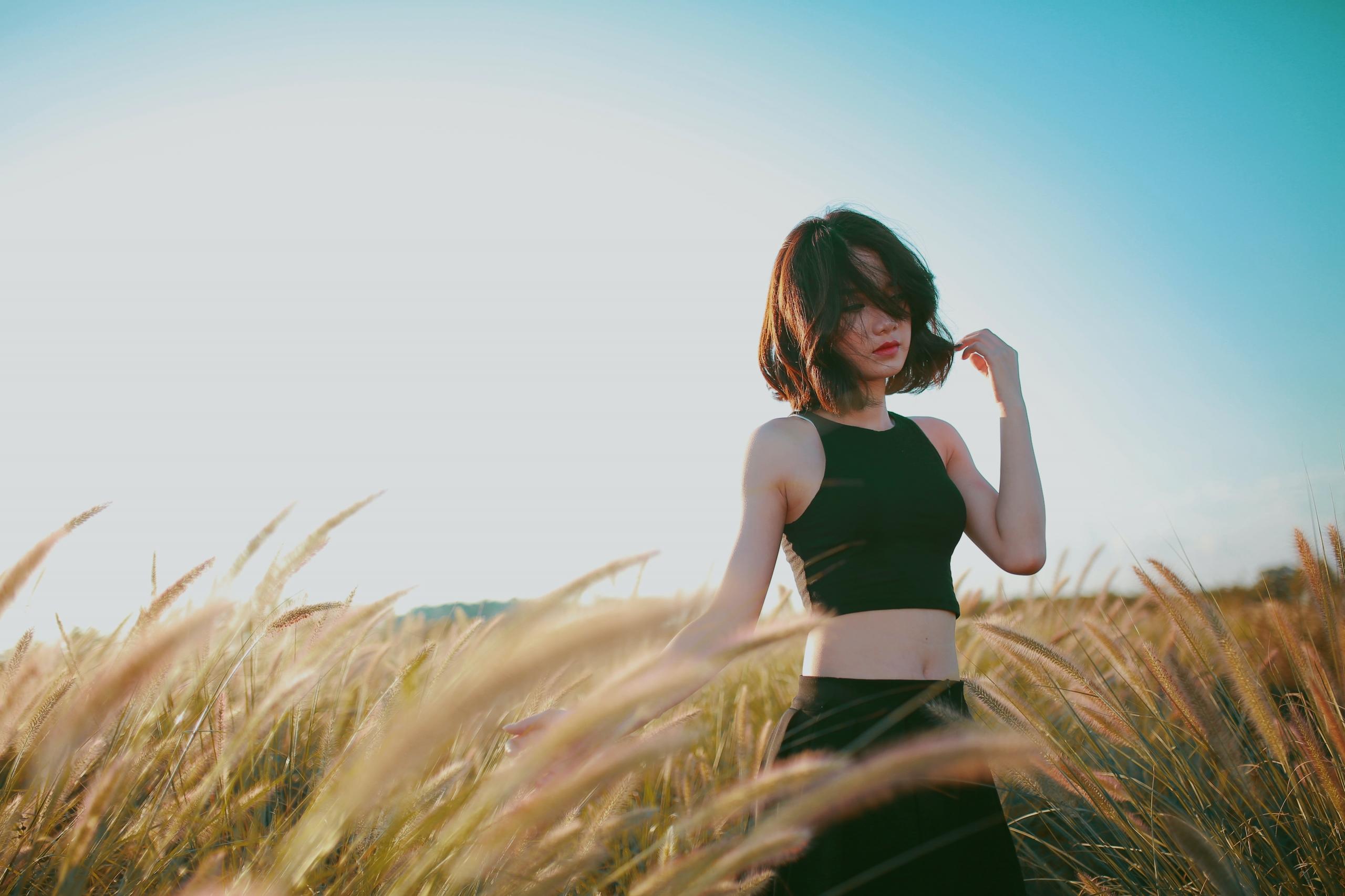 editorial photoshoot of asian girl in a field