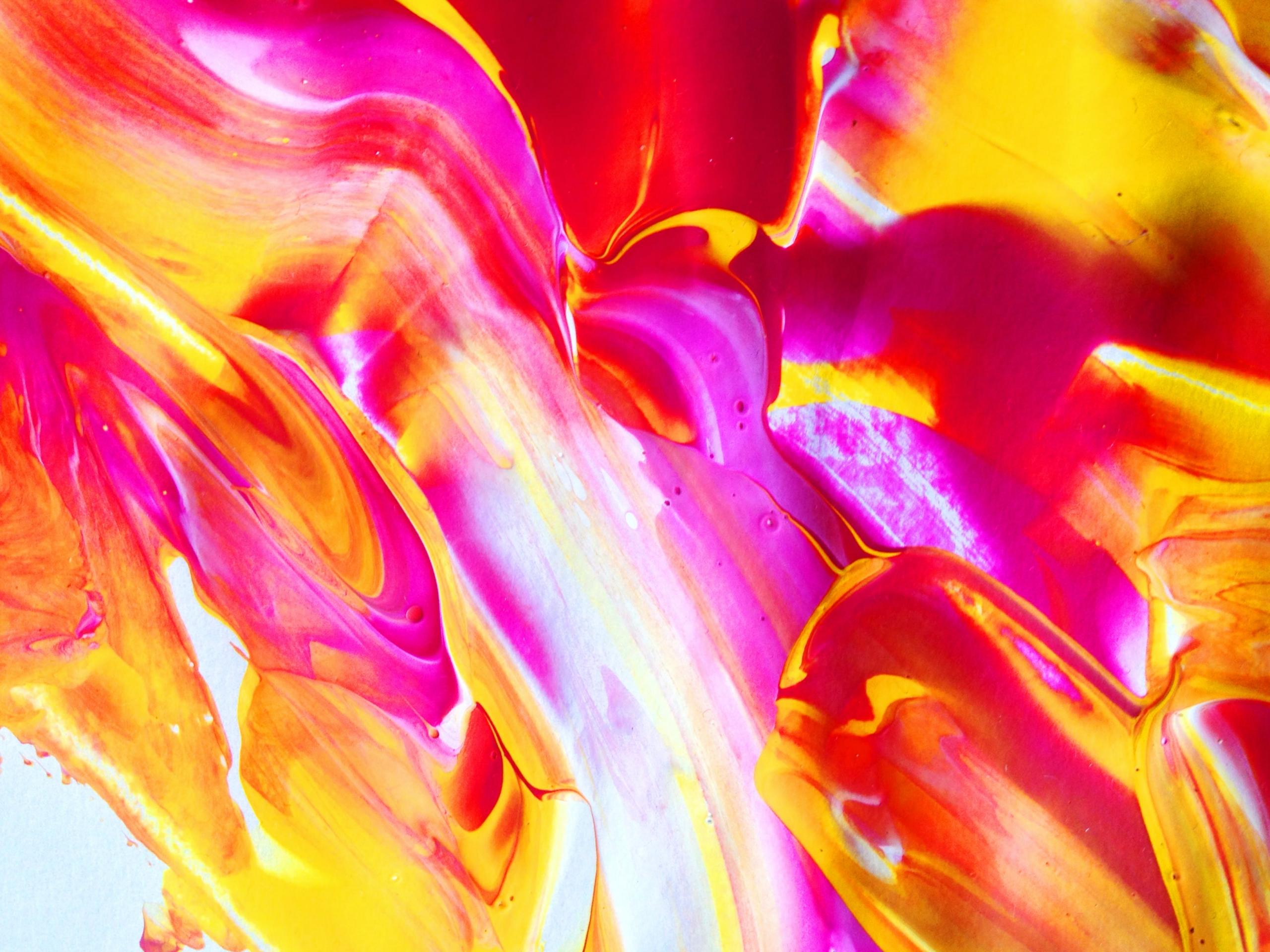 abstract artwork from oil paint in pink, red, yellow and orange