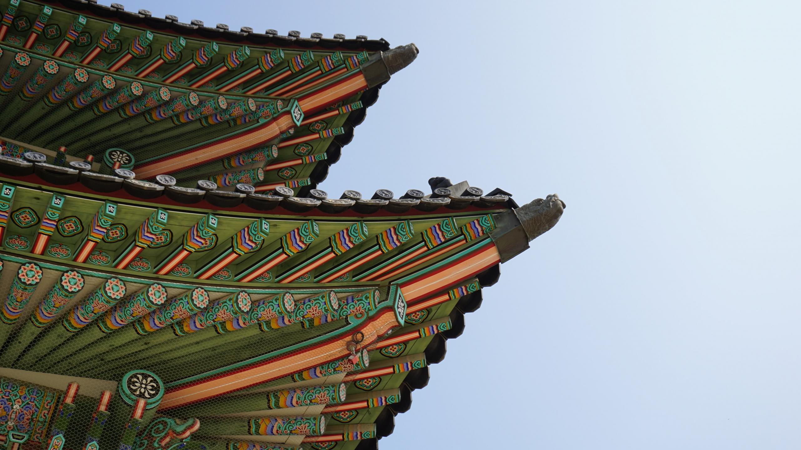 close up of the colourful roof tiles of a temple in Korea
