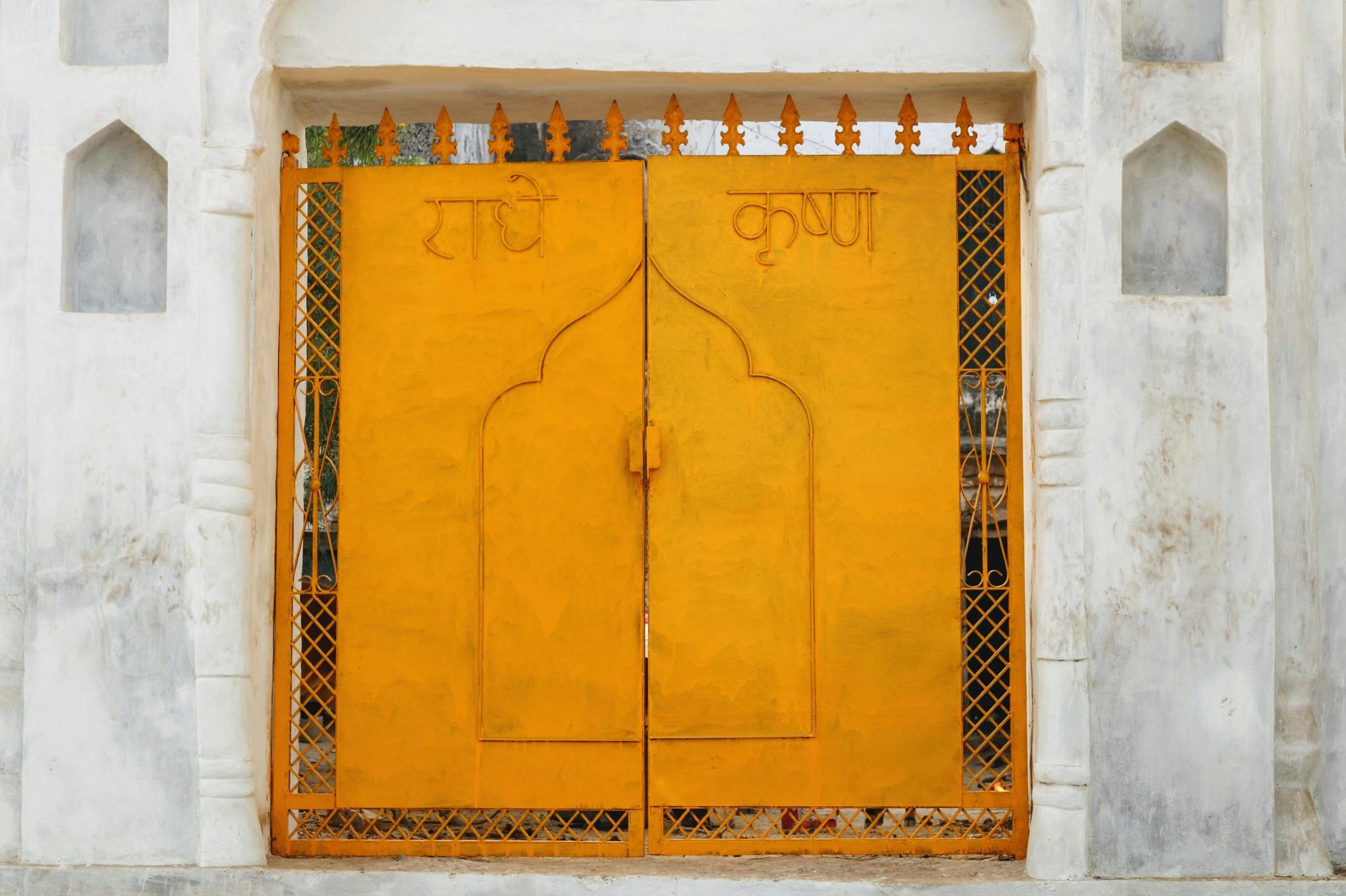 yellow doors inscribed with hindi words in India
