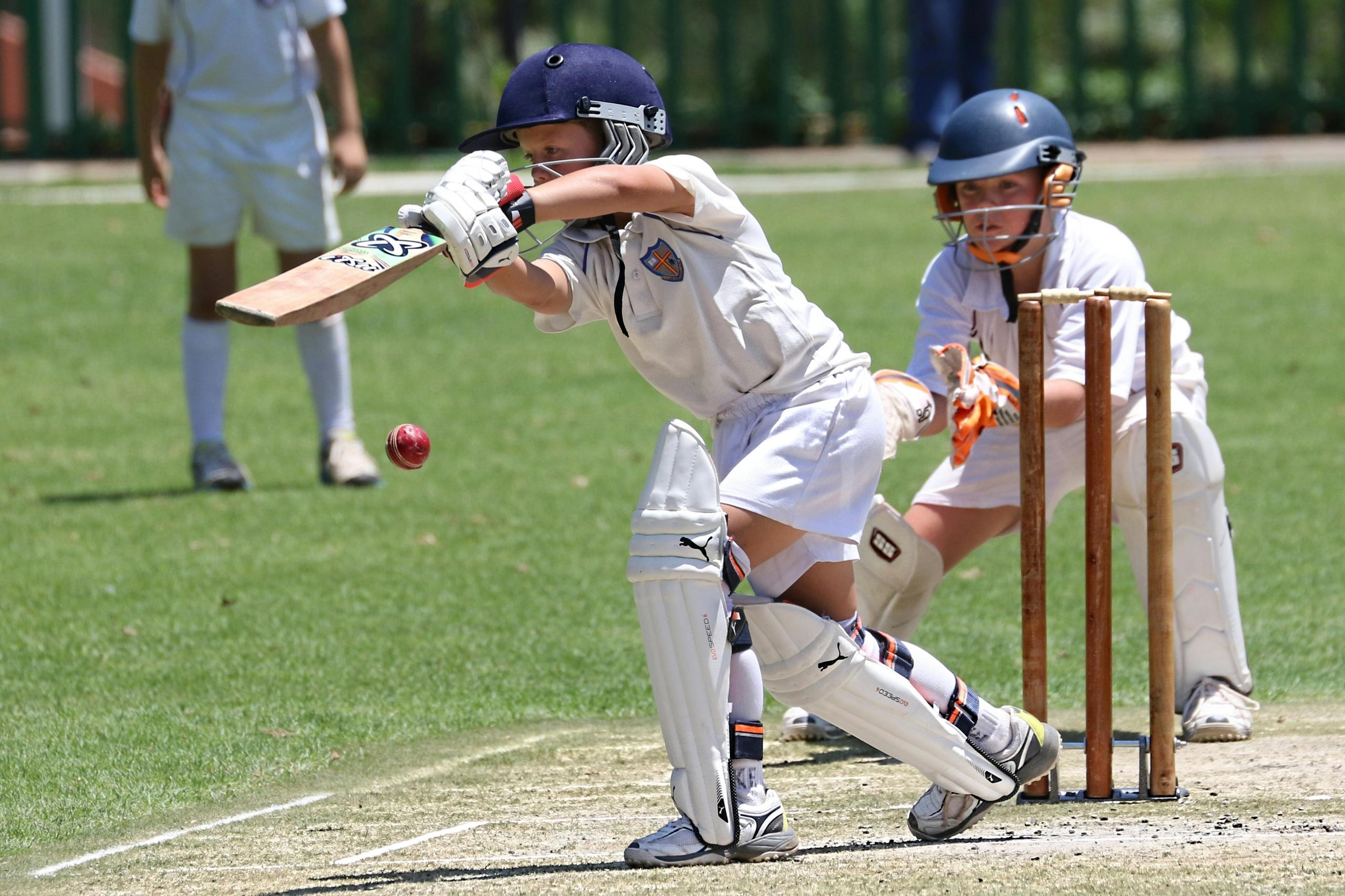 young boys playing cricket