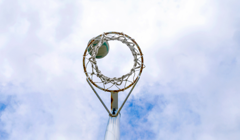 netball being thrown into netball hoop