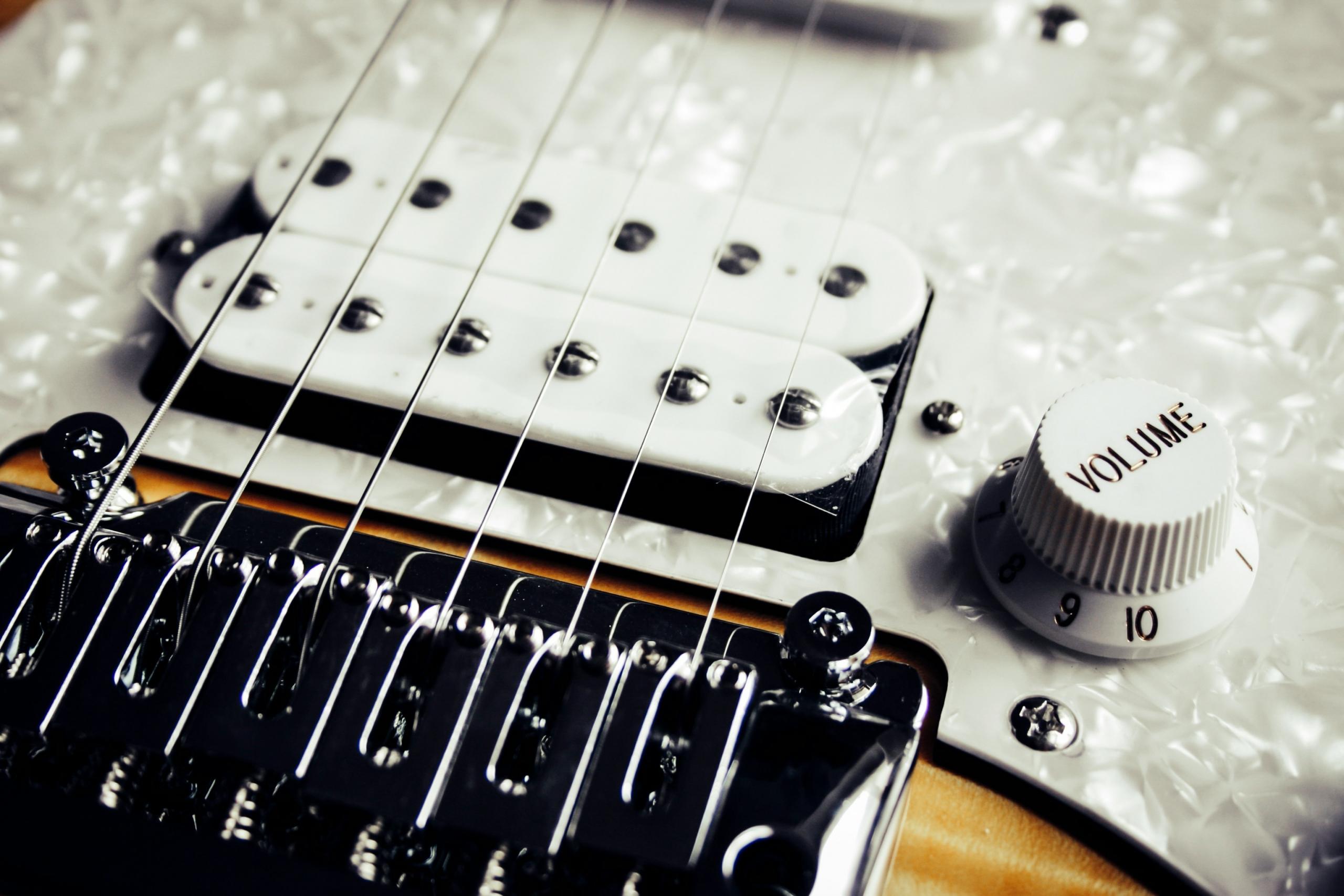 close up of white electric guitar