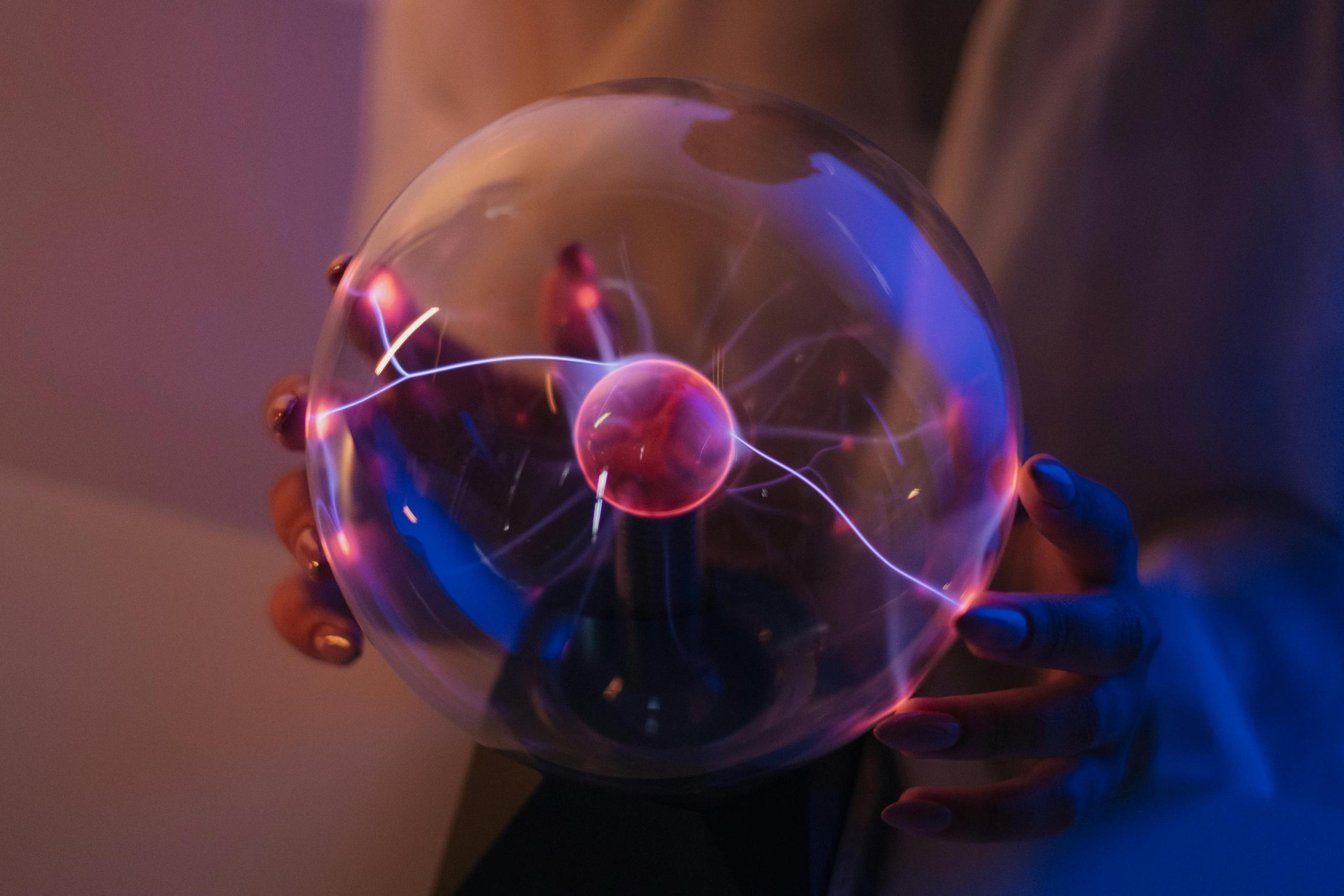 person holding plasma sphere